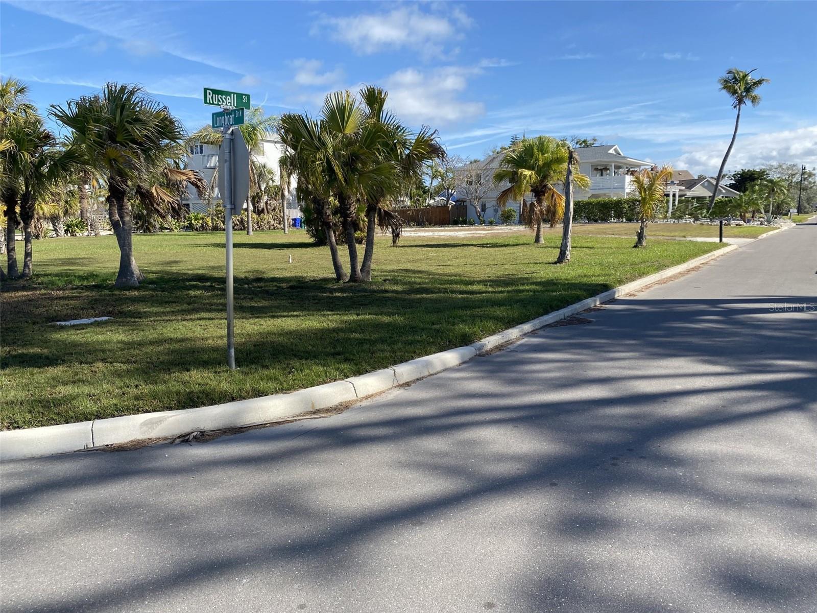 Beautiful, estate sized corner lot north end of Longboat Key in the historic and charming Village of Longbeach. Water & underground electric in place and property is prepped to build on. A prestigious community with one of a kind restaurants, some with Michelin stars, Diamond rated hotels with spectacular amenities and the best of the best golf courses. Shopping, boating and biking are fabulous if you're not enjoying the beach which is steps away or playing tennis and pickleball. Community boat ramp and dock are 2 blocks away. The relaxed vibe of the north end is tranquil, quiet and allows residents to immerse themselves in the beautiful nature surrounding them.