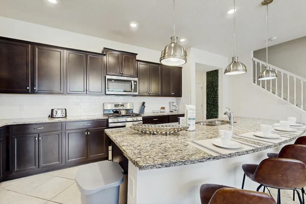 Photo of 7472 Oakmoss Loop, Davenport, FL 33837 (MLS # O6362792)