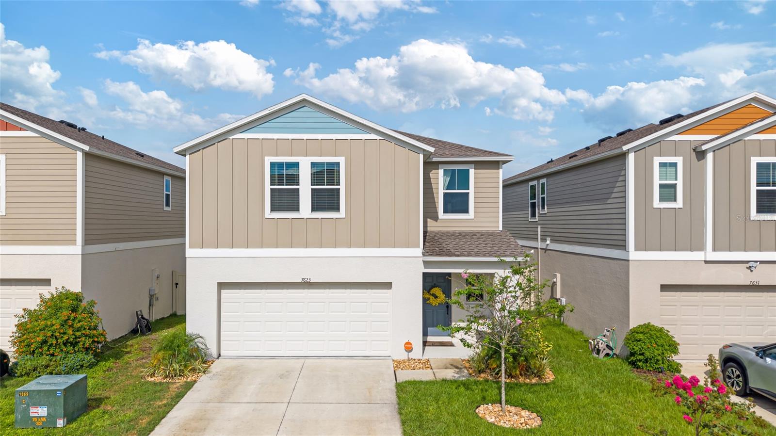 You’ve got to see this stunning nearly-new home that’s ready to impress! Just 2 years old, this beautifully upgraded 4-bedroom, 2.5-bath gem combines modern style, smart upgrades, and move-in ready perfection. Step inside to luxury vinyl plank flooring, soaring ceilings, and an open floor plan flooded with natural light. The gorgeous kitchen boasts quartz countertops, a spacious center island, and views straight to the backyard through sliding doors—ideal for entertaining family and friends. Enjoy the added bonus of a whole-home water softener system for better water quality and appliance longevity. This home truly shines with a two-car garage, a fully fenced backyard perfect for privacy and pets, an automatic sprinkler system, and fresh, updated landscaping that boosts curb appeal. Upstairs, the large loft offers endless possibilities—think second living room, home office, or play area. The primary suite is a dream with two walk-in closets and an en suite bathroom featuring double sinks and quartz countertops. Three additional spacious bedrooms, a full bath with a rain shower, and a convenient upstairs laundry room complete the picture. Enjoy peace of mind with no rear neighbors and a location less than a 5-minute walk from amazing resort-style amenities—including a zero-entry pool, playground, and dog park. Plus, you’re just minutes from Florida’s first man-made lagoons, bringing everyday resort-style living right to your doorstep. With no CDD fees and still under the builder’s 10-year structural warranty, this home truly has it all. Don’t miss your chance—this is the home you’ve been waiting for! Schedule your showing today before it’s gone!
