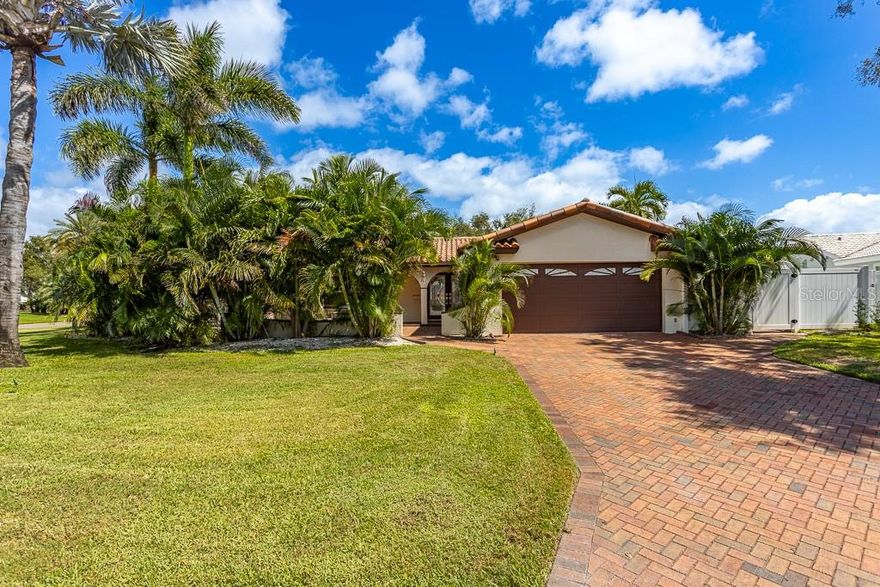 One or more photo(s) has been virtually staged. ASSUMABLE LOAN AT 4.5%! Welcome to Yacht Club Estates, one of St. Petersburg’s most desirable neighborhoods. This fully permitted, top-to-bottom remodel offers 2,200 sq. ft. of modern living with 4 bedrooms, 2 bathrooms and a 2-car garage. The open-concept floor plan features a brand-new kitchen with stainless-steel appliances and an oversized bar—perfect for everyday living or entertaining. The private primary suite includes a spacious bedroom, en-suite bath, and walk-in closet, while a flexible bonus room off the family room works beautifully as a home office, nursery, or 4th bedroom. An inviting courtyard sets the stage for outdoor dining and gatherings, and the side yard offers plenty of space to add a pool. Nestled on a quiet, tree-lined street with underground utilities, the home blends privacy and charm with an unbeatable location. Lifestyle Highlights: Minutes to Treasure Island beaches and 15 minutes to downtown St. Pete - Vibrant boating community- Kayaking group, Mom’s group and Book clubs. Friendly neighbors and refreshing Gulf breezes year-round. This home embodies the best of Florida living. Schedule your private showing today!