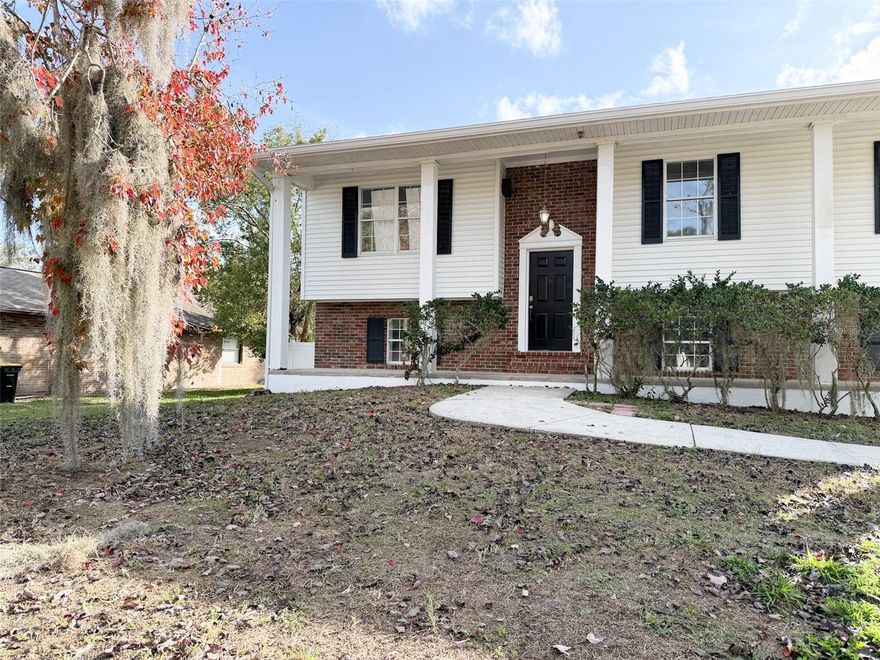 Experience the perfect blend of modern upgrades and established charm in this move-in-ready, 4-bedroom, 2-bathroom split-level home located in the sought-after Sheffield Subdivision of Lakeland. This home has been meticulously renovated to offer a functional open floor plan. The heart of the home is the kitchen/family room combo, featuring a center island, updated cabinetry, and stylish luxury vinyl plank (LVP) flooring that flows throughout the entire interior and through the back door you will find a beautiful deck overlooking the backyard. This is a true 4-Bedroom Layout reconfigured in 2024 to include a fully enclosed lower-level bedroom with a private door, closet and the laundry room is situated downstairs.   If this 4th bedroom is not needed this would make a perfect downstairs playroom with easy access to outside. Major Systems Updated within 6 years include Roof (2020+), HVAC, blown-in insulation, gutters, and water heater for maximum energy efficiency and lower insurance premiums. Freshly painted with updated window casings, trim, and hardware. Both bathrooms have been fully modernized, with a walk-in shower in the primary suite. Enjoy a fully fenced huge backyard with a new vinyl privacy fence and fresh sod (installed late 2025). The previous pool was professionally removed with all permits closed, creating a massive, level yard perfect for pets or play. This home had it's electrical brought to code with new breakers and outlets. New ceiling fans, LED lighting, and plumbing fixtures throughout. Pressure washed, shutters repainted, and features a covered porch, deck, and balcony.  This home situated on a quiet paved road in North Lakeland, you are minutes away from premier shopping, schools, and easy commuting routes. With no HOA fees, this home offers the freedom and peace of mind you’ve been searching for.  Schedule your private showing today—this updated gem won't last long!  Professional photos of the interior will be up soon.