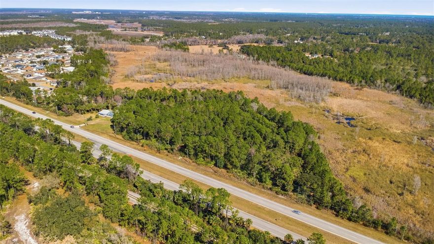 Nearly 9.94-acre agricultural parcel located on the east side of US-1 in a newly annexed area within the City of Palm Coast. The property offers approximately 592 feet of frontage along busy US-1 and presents an excellent opportunity for a buyer to work directly with the city regarding future zoning and land use. Currently designated Agricultural by the City of Palm Coast Planning & Zoning.

Strategically located north of Old Dixie Highway and south of Seminole Woods Boulevard, with convenient access to US-1, I-95, and nearby markets including Ormond Beach, Daytona Beach, and St. Augustine. The State of Florida has recently completed a new roundabout near the property, enhancing traffic flow and accessibility in the area.

Electric utilities are located immediately in front of the property, with water and sewer connections nearby. Survey available. Offered below appraised value, with owner financing available, making this a compelling opportunity for investors and entrepreneurs seeking acreage in a growing Palm Coast corridor.

Buyers are encouraged to verify zoning, allowable uses, access, utility availability, subdivision potential, and any future development possibilities directly with the City of Palm Coast and appropriate service providers.
