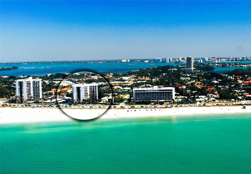 ST. ARMANDS TOWERS SOUTH - Located across the street from the crystal blue waters of Lido Beach, and two short blocks from St. Armands Circle, this furnished fifth-floor condo is the epitome of coastal chic with 1,275 sq ft of interior living space in an open floor plan, with two bedrooms and two full bathrooms. The east-facing residence extends a refined yet relaxing living experience with style that includes natural textures, a palette of coastal colors, and generous sliding glass doors from the living room and both bedrooms to the spacious balcony, creating an open airy feel throughout the space. Thoughtful updates such as ceiling fans and oversized tile floors are a perfect complement to the Florida lifestyle. The kitchen is open to the spacious living room and dining room, and is equipped with recessed lighting, stone counters, an undermount sink, beautiful cabinetry with plenty of storage, and stainless appliances. The primary bedroom includes an en suite bathroom and generous walk-in closet, and the additional bedroom is perfect for a home office, or an extra room for guests. There is a storage closet in the unit, and one covered carport space is included, with a private storage locker for beach toys. St Armands Tower South is a well-managed, pet friendly building (up to 25 lbs), with amenities that include a heated pool with Gulf views, beautifully updated lobby, community room with kitchen, library, and fitness room, with a laundry room on each floor, onsite management and maintenance supervisor. When you’re not at the beach, enjoy the upscale European ambiance on St. Armands Circle with art galleries, retail therapy, relaxing spa services, gourmet & casual sidewalk cafes, a vibrant social scene, a pedestrian-friendly promenade, and an array of local events just around the corner. The iconic Lido Key location is also just 3 miles from downtown Sarasota, so you can truly experience the metropolitan sophistication of Florida’s “Cultural Coast” from an elegant beachside locale at St. Armands Towers South.