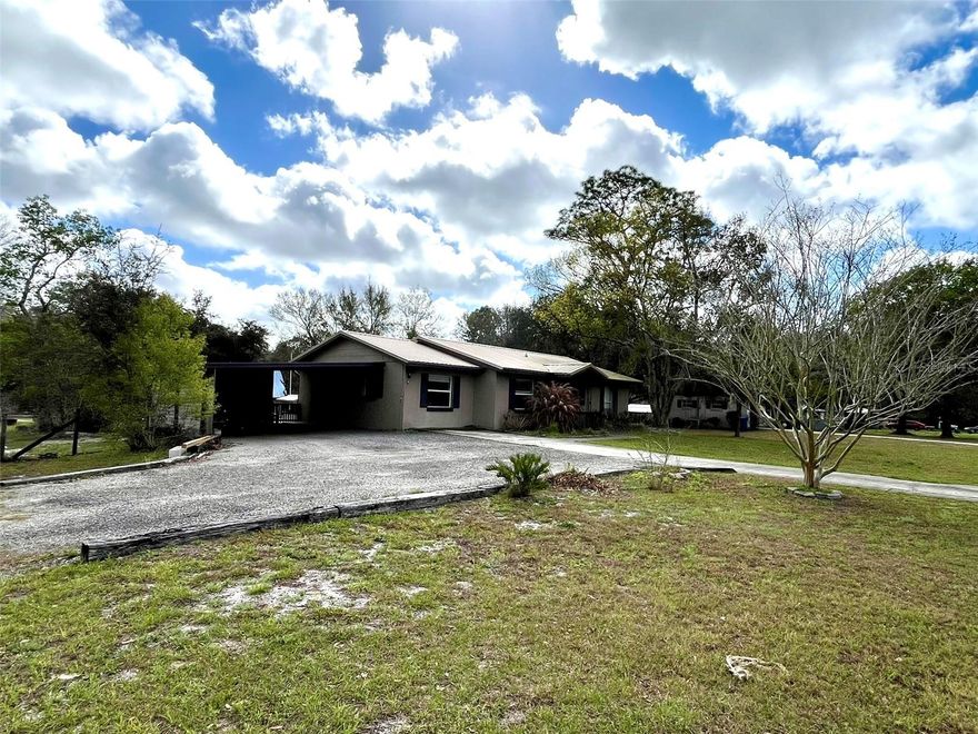 This 3-bedroom, 1-bath home in De Leon Springs sits on over half an acre with Agricultural A-3 zoning and offers plenty of room for outdoor activities, storage, and hobbies. The property features 1,296 sq ft under air plus a 312 sq ft vinyl-window screened porch overlooking the backyard.

Inside, the home includes an updated kitchen and bathroom, updated appliances, and a large tiled shower. The layout provides comfortable living space with easy access to the screened porch for additional indoor-outdoor living.

Recent improvements include a metal roof (2021), HVAC system (2020), new vinyl windows on the screened porch (2026), new backyard sod (2026), and a new concrete patio pad (2026). The home is serviced by well and septic and includes a water filtration system.

The property includes an attached carport, three storage sheds (including a newly built approximately 450 sq ft shed), and plenty of parking space. Additional parking for a boat, trailer, RV, or other vehicles is available in the backyard through a double gate with access from Reynolds Rd., with asphalt millings providing a durable parking surface.

Outdoor features include a fenced backyard, playground equipment and trampoline that will remain, and a corner lot location on Sue St. and Reynolds Rd. with access from both streets.

Professional photos coming soon. Listing agent is the property owner. Shown by Appointment only. All information deemed reliable but not guaranteed. Buyer and buyer’s agent to verify measurements, zoning, and any information important to them.