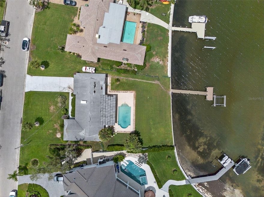 Amazing opportunity to create your waterfront estate in Sapphire Shores, where history, culture, and growth meet. This 16,378 sq. ft. lot offers 87 feet of water frontage, a private dock, and direct access to Sarasota Bay. Positioned along a quiet shoreline, it overlooks an almost 900-foot-wide deep-water basin, providing both privacy and natural beauty. Sapphire Shores combines legacy estates, striking new builds, and proximity to cultural landmarks such as The Ringling Museum and Asolo Theatre. With the North Trails ongoing transformation, including new developments, zoning updates, Ringling Colleges expansion the neighborhood is emerging as a prime location for luxury residences. Whether for a custom estate or a speculative project, this is a rare chance to secure a large waterfront property in one of Sarasota's most dynamic luxury neighborhoods.