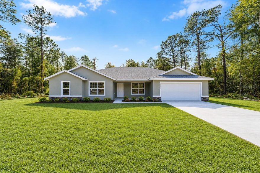 One or more photo(s) has been virtually staged. Brand-new 4-bedroom, 2-bath home situated on a 1.16-acre lot in the sought-after Dunnellon Rolling Hills community, just minutes from the World Equestrian Center (WEC). Enjoy the charm of rolling hills, scenic countryside, and nearby horse farms while still being conveniently close to shopping, dining, and medical facilities. This thoughtfully designed home features luxury vinyl plank flooring throughout the main living areas, tile flooring in the bathrooms, and carpeted bedrooms for added comfort. The open-concept layout includes a spacious dining area and an eat-in kitchen with neutral tones that create a warm and inviting atmosphere. Additional highlights include an indoor laundry room with washer and dryer hookups, a walk-in closet in the primary suite, stainless steel kitchen appliances, shaker-style cabinetry, and elegant light granite countertops.