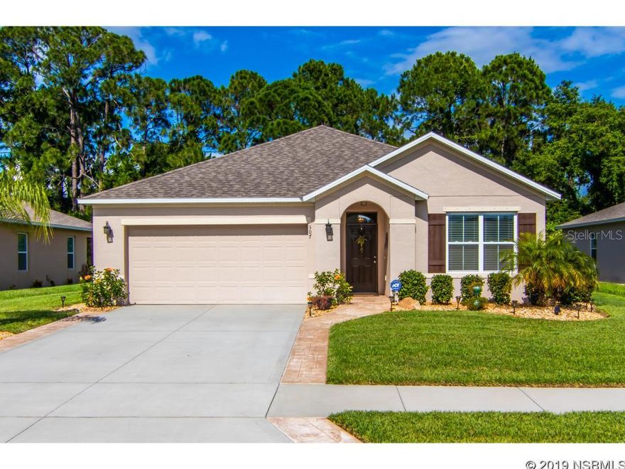 Located in Edgewater Lakes, this 3 bedroom 2 bath home is a relaxing retreat. This beautiful home has an open floor plan, high ceilings, and a gorgeous view of the wooded preserve complete with a screened in porch. The kitchen offers granite countertops, a granite backsplash, and an oversized kitchen island. The master bedroom has beautiful views of the preserve along with a walk-in closet and a master bath that offers dual vanities and a walk-in shower. Owners have included an American Whirlpool Hot Tub on the screened in porch. The home includes new interior fresh paint, new kitchen range, new dishwasher, stamped concrete along the driveway and entryway, and upgraded lighting fixtures throughout. The owner went even further to keep the home's electric cost low, by installing spray foam insulation in the rafters and an attic tent with thermal barrier. ;Water: City