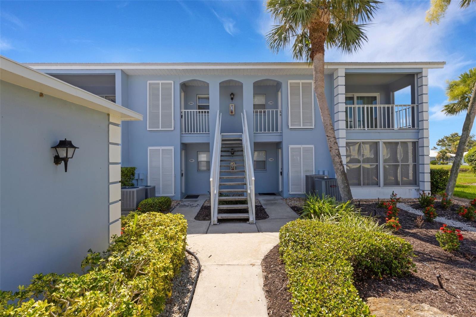 Welcome to this beautifully maintained, TURN KEY furnished, 2nd-story 2-bedroom, 2-bathroom condo located in the highly sought-after Farmington Vistas community within the stunning Plantation Golf and Country Club. This light and airy residence offers an open-concept layout and a neutral palette—ready for your personal touch. As you enter, you’re greeted by a well-appointed kitchen featuring sleek tile flooring, abundant cabinetry, matching appliances, unique lighting fixtures, and built-in shelving to keep things organized. A cozy breakfast bar provides the perfect spot for morning coffee, with a convenient passthrough window to the dining area, making entertaining a breeze. The spacious combined dining and living area is filled with natural light and opens up to breathtaking views of the golf course and tranquil lake through large sliding glass doors. The primary suite is a rare retreat, offering a private lanai/balcony, a spa-like en-suite bath with dual vanities, a built-in makeup station, and a luxurious walk-in shower. The second bedroom is equally inviting, with direct access to the extended lanai and an adjacent full bathroom with a shower/tub combo—ideal for guests, a home office, or hobby space. Additional highlights include an inside laundry closet and a designated covered parking space for added convenience. Farmington Vistas offers a vibrant lifestyle within the Plantation Golf and Country Club, home to two championship 18-hole golf courses and the LPGA Tour Qualifier. Enjoy access to optional memberships that include golf, tennis, pickleball, fitness programs, fine dining, and social events—something for everyone! Centrally located just minutes from Wellen Park, the Atlanta Braves' Spring Training facility, Sarasota Memorial Hospital - Venice, and historic Downtown Venice with its charming shops, restaurants, theaters, and weekly events. Several world-class Gulf beaches and the laid-back charm of Old Florida's Englewood are also just a short drive away. Don’t miss the opportunity to make this exceptional condo your own, call today to learn more before it's gone!
