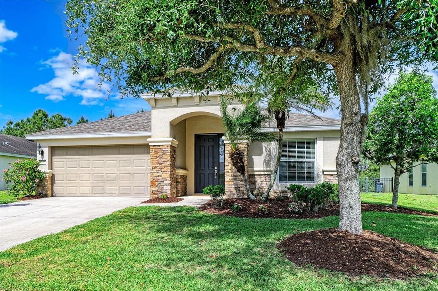 One or more photo(s) has been virtually staged. Welcome to your next home in Harrison Ranch! This 4-bedroom, 2-bathroom home offers the perfect blend of comfort, style, and functionality. From the moment you arrive, you’ll notice the stunning stone-facing exterior that adds timeless curb appeal. Step inside to find a welcoming living and dining room combination, ideal for both everyday living and hosting guests. The heart of the home is the upgraded kitchen, featuring stainless steel appliances, quartz countertops, a stylish tile backsplash, and a cozy eat-in space. The kitchen flows seamlessly into the family room, creating an open-concept layout perfect for entertaining. Designed with privacy in mind, the home offers a desirable split floorplan. The master suite is tucked away on one side of the home and features 2 closets and an ensuite bathroom complete with dual sinks, a garden tub, walk-in shower, and a separate water closet. On the opposite side of the home, you’ll find three additional bedrooms and a full bathroom, perfect for family or guests. Enjoy beautiful sunsets when you step outside to the fully fenced backyard with serene pond and preserve views, offering both privacy and a peaceful setting. Major updates provide peace of mind, including a new roof in 2025 and AC replaced in 2021. Additional highlights include a dedicated laundry room, irrigation system, and hurricane shutters for added convenience. Recent school rezoning has Harrison Ranch going to a new High School, which opened in 2019. Harrison Ranch offers a 24 hour gym, heated junior Olympic pool, tennis/pickleball/basketball courts, playgrounds, ball fields, and 5.5 miles of beautiful hiking trails. An activity director is also on-site, putting on fun events for families as well as active adults. Tampa, St. Pete, Sarasota and beautiful beaches are all within 45 minutes, making this a perfect central location. Harrison Ranch offers you a beautiful community and a lifestyle you can truly enjoy.