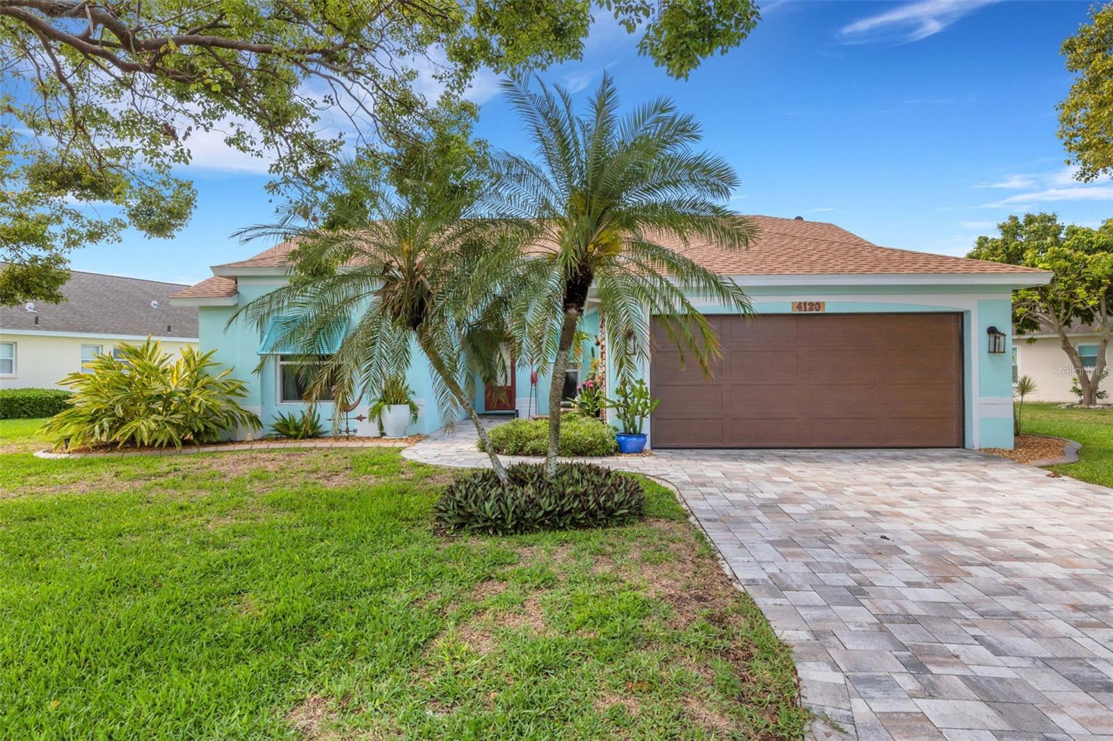 Welcome to your Florida Dream Home. This fully updated, 3 bedrooms, 2 baths home with heated saltwater pool is ideally located in a small, peaceful community just 9 miles from Anna Maria Island & Longboat Key Beaches. It is just minutes from restaurants, shopping (including the new Detwiler's Grocery) and top schools like IMG Academy, State College of Florida’s Bradenton campus, and Electa Lee Magnet Middle School. This home boasts engineered hardwood floors throughout all bedrooms and living areas, with durable ceramic tile in the kitchen and bathrooms. The chef’s kitchen is equipped with soft-close cabinets and drawers, stainless steel appliances, and elegant quartz countertops. Both bathrooms feature updated cabinetry with soft-close hardware, while the primary en-suite offers 2 leather-finished granite countertops for that extra touch of luxury. Enjoy the bright, open feel of the cathedral ceilings in the living and dining rooms, highlighted by a wall of impact-rated sliding glass doors and windows that overlook the screened-in pool and serene pond. The primary suite also offers private access to the lanai and pool area, ideal for relaxing mornings or peaceful evenings. This home was exceptional when the current owners purchased it in 2024 but they added hurricane windows and sliding doors throughout, a beautiful impact garage door, and an extra mini split AC unit in the primary bedroom. A completely new roof was also added in May of 2025. This home has been meticulously maintained and thoughtfully improved with no detail overlooked. The current owners planned to keep it forever—but life had other plans. Now, their dream home can be yours. Just move in and start living the Florida lifestyle you’ve been dreaming of.