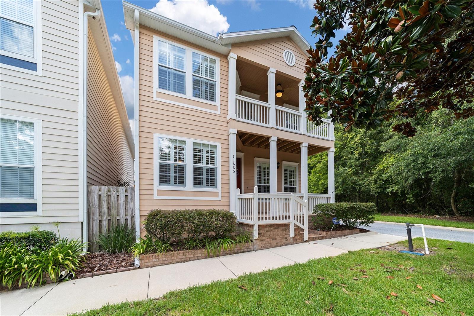 Corner-Lot Beauty with Upstairs Balconies in Prime Gainesville Location! Welcome to this stunning residence in the sought-after community of Charleston Park, Fletcher's Mill. Perfectly positioned on a spacious corner lot, this home immediately captures attention with its curb appeal and thoughtful design. Step inside to discover a flowing layout filled with natural light, generous living spaces, and stylish finishes that blend comfort with sophistication. The downstairs primary suite offers the ultimate in convenience and privacy, featuring direct access to the courtyard and garage, as well as the laundry area and a spacious master bath. Upstairs, you’ll find two bright bedrooms and a full bath, each flowing with natural light and designed for comfort. A downstairs half bath ensures that guests and family alike have their needs met no matter where they are in the home. Upstairs, enjoy the charm of private balconies, perfect for sipping morning coffee, unwinding at sunset, or taking in the peaceful neighborhood views. The outdoor living opportunities don’t stop there—whether entertaining friends or simply enjoying quiet evenings, the balconies and yard make every day feel like a retreat. This home is more than just beautiful—it’s also incredibly conveniently located. Just minutes from shopping, dining, top-rated schools, healthcare, and Gainesville’s vibrant amenities, you’ll love the balance of privacy and accessibility. Commuting is easy, and with parks and recreation nearby, there’s always something to enjoy.
From the thoughtful floor plan with its main-level master retreat to the inviting balconies and unbeatable proximity to everything Gainesville, this home is one you don’t want to miss!