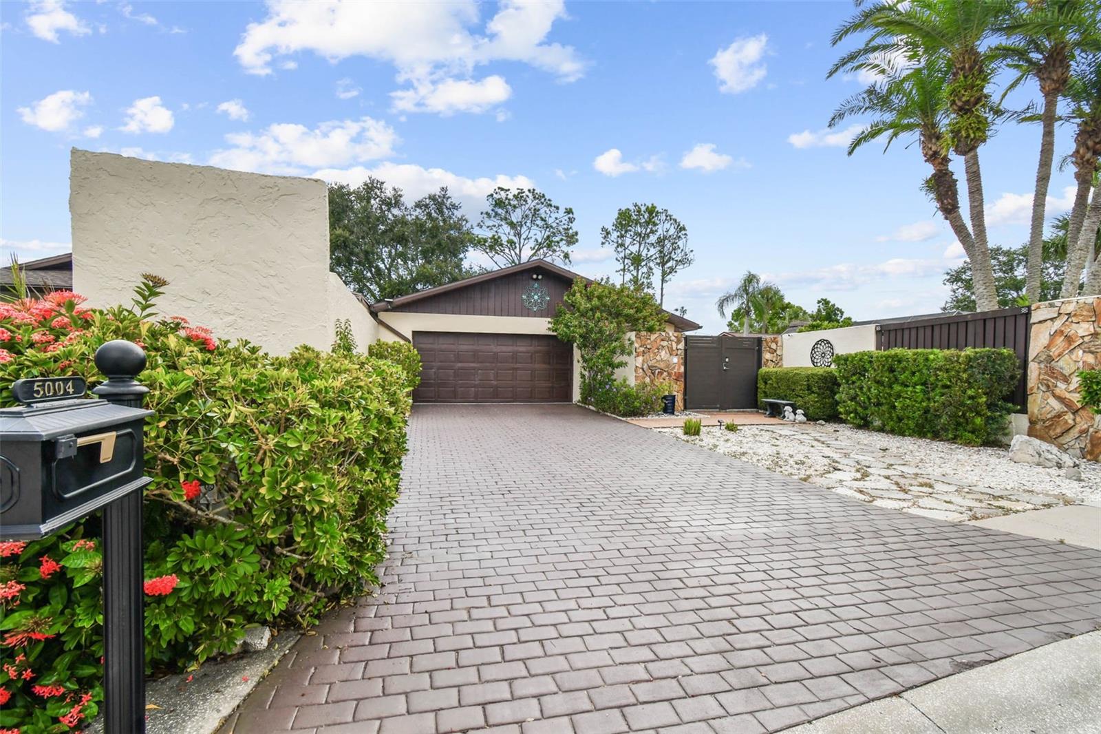 Rare Double Courtyard Find In The Avista Subdivision Of Carrollwood Village!!This stunning 3 bedroom/2.5 bath pool home sits on just under ¼ acre making it one of the largest lots in Avista. Enjoy total privacy in your personal paradise, surrounded by 8-foot walls creating a serene and secure oasis. As you walk in the front courtyard, you’ll be greeted by the refinished beautiful saltwater pool, complete with stunning waterfall and 5-person spa perfect for relaxing and entertaining. The home also features a lush back courtyard offering a Zen-like, tranquil retreat for quiet moments. Inside, vaulted spacious layout with tasteful finishes and stunning porcelain fireplace, ensuring comfort and charm at every turn. This home is only a 15-minute drive to TIA, 5 minutes from restaurants and shopping and the Carrollwood Village Park around the corner. Don’t miss the opportunity to make this unique property yours!