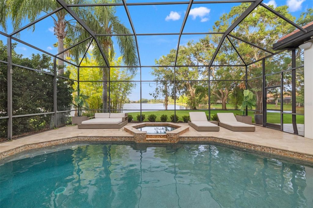 Photo of 9712 Tree Tops Lake Road, Tampa, FL 33626 (MLS # TB8395028)