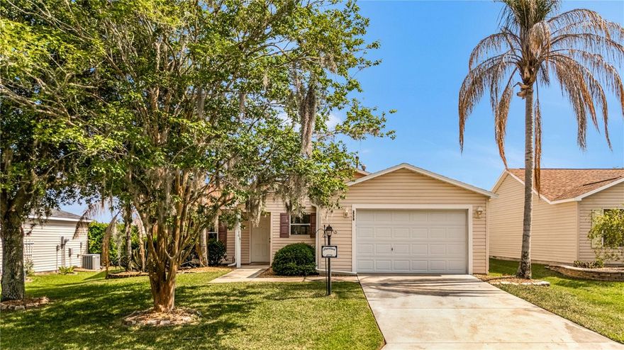 PRICE TO SELL! LOCATION is the KEY to this 2BR/2BA LAREDO OPEN concept floor plan. This home is ideally located in The VILLAGE OF LYNNHAVEN (near Belvedere) between CR466 and Lake Sumter Town square (BETWEEN THE 6's). This home has close access to pools, recreation centers, pickle ball, library, banks, medical, Polo field, golf courses and abundance of restaurants and shopping (Incl. COSTCO). The bright kitchen has a breakfast bar, gas stove, microwave, dishwasher and stainless-steel refrigerator. The spacious living room and dining area combo has CATHEDRAL HIGH CEILINGS. The home has recently (5/2026) been PAINTED and NEW FLOORING throughout (see photos). PRIMARY BEDROOM is spacious with a WALK-IN CLOSET. The master bathroom has a walk-in shower. The SPLIT FLOOR PLAN offers privacy with the second bedroom perfect for guest or office. Guest bathroom has a tub/shower. The patio sliding glass doors lead to SCREEN-IN LANAI. Easy golf cart access to Churchill Green Executive Golf Course and Arnold Palmer Championship 27 hole golf course. "LOVIN THE LIFESTYLE" WITH FREE NIGHTLY ENTERTAINMENT only minutes away from Lake Sumter. This home is price for your touch of upgrades to make this your special home. Make your appointment today!