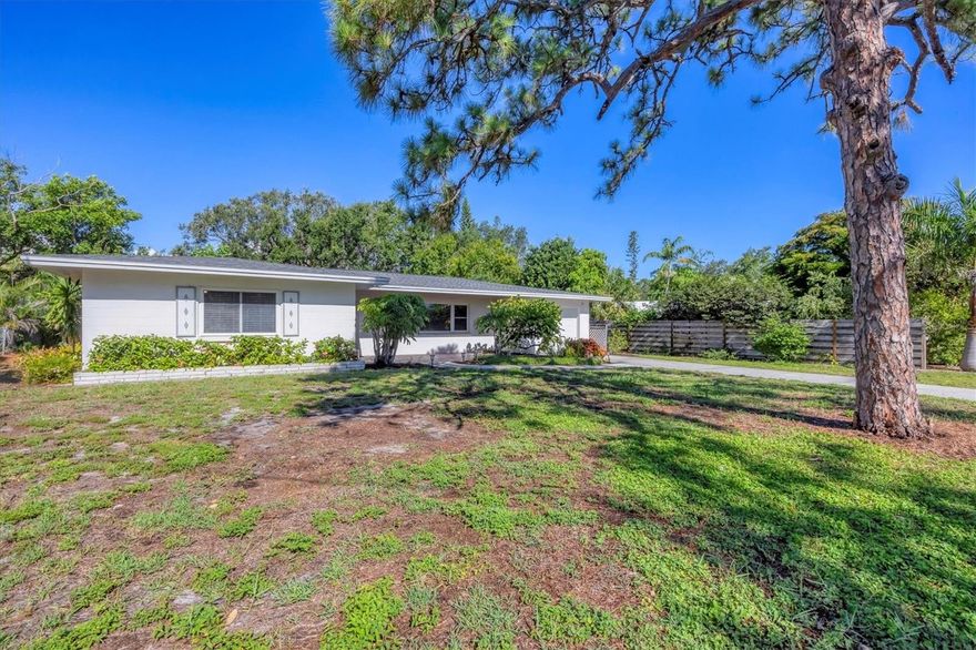 This charming Mid-Century home is located in the highly sought-after Indian Beach/Sapphire Shores neighborhood. This is not just a house it is a piece of Sarasota history - custom built by V & A builders, who not only have deep roots in the community, but were also recognized in the 1963 Parade of Homes! Featuring 4 bedrooms, 3 bathrooms and 2016 square feet of living space this property is situated on a quiet, tree-lined street and offers a spacious layout ideal for both full-time residents and seasonal enjoyment. As you enter the home, you will be greeted by a spacious open floor plan filled with natural light. The updated kitchen includes granite countertops, stainless steel appliances, and solid wood cabinets. It is open to a family room and formal dining area. What is currently the primary suite has a full bathroom, closet and built in desk - with its generous size this could also be used as an in-law suite, as it has a separate entry through the 1 car garage. The original primary bedroom offers a large cedar closet and an en-suite powder room. Two additional bedrooms share the full hall bathroom. Step outside to enjoy the screened lanai and large backyard with mature landscaping; ideal for entertaining, gardening, or relaxing in a private setting with plenty of room for a pool if desired. The curved ceilings, crown molding, terrazzo flooring and other original details are sure to impress. The recent upgrades include new carpet, new interior paint, new roof (2024), remodeled primary powder bath (2025) and impact windows (2000). This desirable neighborhood, in the museum district, offers two fido friendly parks on the water with kayaking, fishing and breathtaking sunsets all a short stroll away. Just minutes from downtown Sarasota, The Ringling Museum, Sarasota Bay, and SRQ Airport, this location provides easy access to some of the area's best cultural venues, dining, shopping and Gulf beaches.