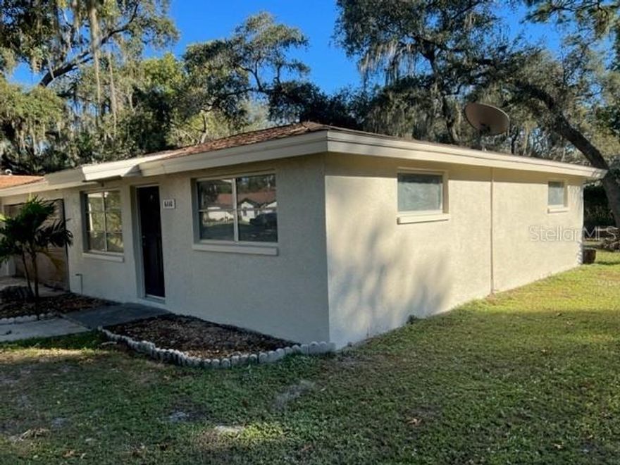 Here we have 2 bedrooms, 1 bath, 1 utility room with washer/dryer and room for storage, a living room with beautiful hardwood flooring and ceramic tile in the kitchen with wooden shaker cabinets and granite counters. Huge open back yard and a little open patio, parking room in back as well as on driveway out front. Exterior freshly painted inside also freshened up! Plenty of parking and includes lawn service. Looking for the you to make this home!