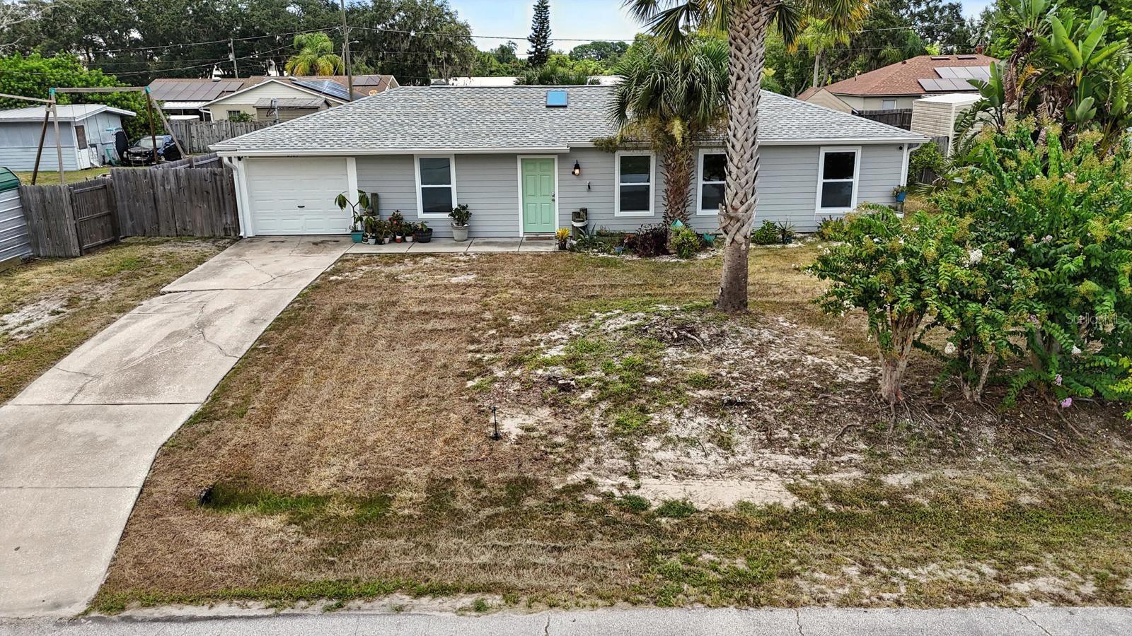 Completely Renovated & Move-In Ready! This beautifully updated 3-bedroom, 2-bathroom home in Edgewater sits high and dry on an elevated lot with no history of flooding and no HOA. Step inside to discover modern tile flooring, a sleek, updated kitchen, and renovated bathrooms, plus the convenience of an indoor laundry room. The property offers exceptional storage and workspace with two outbuildings—an 8x10 shed and a spacious 10x20 workshop. Major upgrades include a brand-new roof (2025), HVAC system (2024), water heater (2022), and new siding, offering peace of mind for years to come. Located just minutes from I-95, the Intracoastal Waterway, parks, and shopping. Stylish, functional, and ready for your personal touch—this home checks all the boxes!