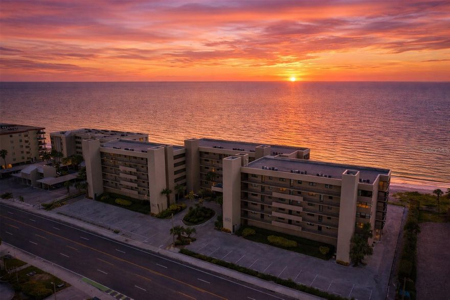 Gracefully positioned at the heart of a beautifully reimagined beachfront community, this elegant coastal residence enjoys what many consider the most desirable placement within the building—centrally located for a direct, unobstructed view of the Gulf and just moments from the sand. The setting offers both immediacy to the shoreline and a sense of balance and privacy that defines true luxury beachfront living.
 *** 
The residence was thoughtfully renovated in 2015 and has been meticulously maintained with no renters since, resulting in a home that feels refined, serene, and exceptionally well cared for. Recent enhancements include a new air-conditioning system and furnace installed in 2022, a modernized electrical panel, and a newer water heater, providing effortless comfort and reliability. Balcony screens are being replaced by the seller, ensuring seamless indoor-outdoor living and enjoyment of coastal breezes.
 *** 
RARE deeded Under-building parking space comes with the unit.
 *** 
The community itself reflects an extraordinary level of care and investment. The Structural Milestone Inspection has been completed in full compliance with Florida SB 4-D, with all recommended work performed, offering invaluable peace of mind. Exterior towers and residences have been freshly painted, and the property’s infrastructure has been comprehensively upgraded.
 *** 
At the center of the lifestyle experience is a beautiful beachfront pool and Jacuzzi, both completely renovated, featuring new plumbing, electrical systems, and elegant updated finishes. The surrounding poolside terrace creates a resort-like atmosphere—ideal for quiet mornings or sunset gatherings—while new secure steel fencing with controlled access enhances privacy throughout the pool and beachside parking areas.
 *** 
The arrival experience has been equally elevated. The main entrance has been entirely redesigned, showcasing new doors and windows, refreshed ceilings and flooring, a modern callbox system, ADA-accessible restrooms, and a refined mailbox area that reflects the quality of the community. Major infrastructure improvements have also been completed, including the replacement of underground plumbing from the water main to the towers, along with new professional landscaping that enhances the coastal aesthetic.
 *** 
Additional improvements are already planned and fully funded through existing storm recovery reserves, including elevator modernization, fire pump replacement, and drive re-asphalting—further reinforcing the long-term integrity and value of the property.
 *** 
The residence is fully paid and in excellent standing, all storm-related special assessments have been satisfied by the seller, and the condominium association maintains strong financials.
 *** 
This is a rare opportunity to acquire a luxury beachfront home in a premier, center-building location—where the Gulf is directly ahead, the beach is just steps away, and the community itself has already undergone meaningful, forward-thinking improvements.
 *** 
Call today to schedule your private tour!