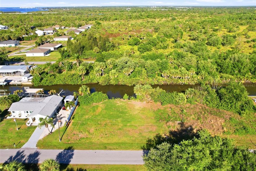 Build your Florida waterfront dream on this exceptional oversized homesite located at 3383 Desoto Drive in Punta Gorda! Spanning nearly 1/4 acre, this prime property sits on a saltwater canal leading to the Peace River and Charlotte Harbor, and direct, unobstructed access out to the Gulf—a true boater’s paradise with no bridges to slow you down. Enjoy the freedom to design your custom home with plenty of space for a large residence, pool, outdoor living area, and more—all while taking in serene water views and Florida’s spectacular sunsets. Whether you're an avid angler, weekend cruiser, or simply love the waterfront lifestyle, this lot delivers the ultimate coastal experience right from your backyard. Minutes from Harbor Heights Park which offers a public boat ramp, picnic areas, playgrounds, tennis courts, and a serene riverside setting for relaxation and recreation. Harbor Heights is a quiet community conveniently located near shopping, dining, golf courses, and the charming historic district of Punta Gorda, you’ll have the perfect balance of tranquility and accessibility. Don’t miss this rare opportunity to own a premium Gulf-access lot and start living the waterfront lifestyle you’ve been dreaming of!
