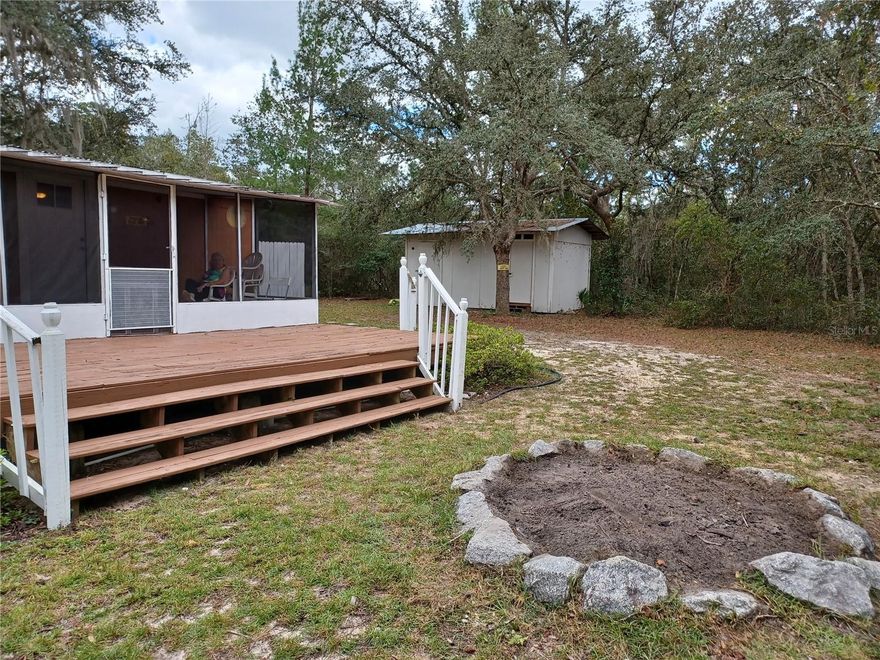 **Your Ideal Home or Serene Retreat Awaits!** This beautifully remodeled 2-bedroom, 1-bathroom home, set on two spacious lots, blends comfort with Florida charm. Recent updates include stylish new flooring, a refreshed bathroom, a new well, and more. With its open floor plan and a 10x20 front screened porch, this home invites you to enjoy the best of indoor-outdoor living. An added outdoor shower is perfect for rinsing off after a day exploring the Ocala National Forest, while the nearby Ocklawaha River offers easy access to water adventures less than a mile away. Don’t miss the chance to experience this unique property—schedule your visit today!