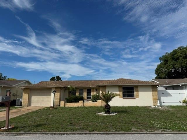 Photo of 7535 Ironbark Drive, Port Richey, FL 34668 (MLS # W7890250)
