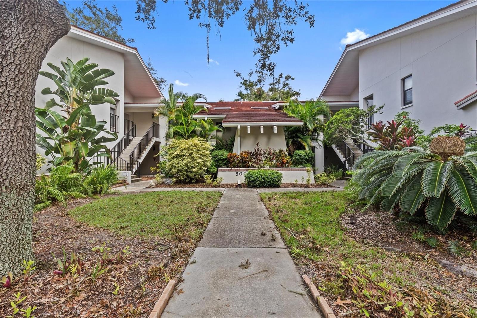 Welcome to your condo, situated in the charming and serene neighborhood of Sunset Shores. This first-floor condo features a split floor plan with two bedrooms and two bathrooms, bathed in natural light and eagerly awaiting new owners to infuse it with energy! Upon entering, you'll discover the dining area, which conveniently connects to the kitchen through a pass-through. To your left, you'll find the guest bathroom and the second bedroom. The spacious living room includes a Florida room, enhanced by sliding glass doors that let in ample sunlight. The master bedroom is conveniently located off the living room, complete with a walk-in closet and an en-suite bathroom. Residents of the community can take advantage of various amenities, including a clubhouse with a fitness center, bike storage, and a lovely waterfront pool. There’s also a dock featuring benches and a kayak launch with a kayak rack for your enjoyment. Each evening, you can relish the sunset over the water from the community dock, just a short stroll from your condo. Additionally, the community offers tennis courts where residents can enjoy pickleball. This building is classified as zone X and has a minimum lease requirement of three months, making it an excellent choice for seasonal renters. Conveniently located close to all three local schools, you can easily walk or bike to Sunset Beach, which is approximately 0.5 miles away. Fred Howard Park/Beach is around 1.6 miles from your doorstep. Tarpon Springs boasts a wealth of attractions, including the renowned Sponge Docks, local breweries, shops, and restaurants downtown, as well as lively festivals and markets, all set amidst beautiful parks. THIS CONDO DID NOT SUSTAIN ANY FLOODING IT'S HIGH AND DRY