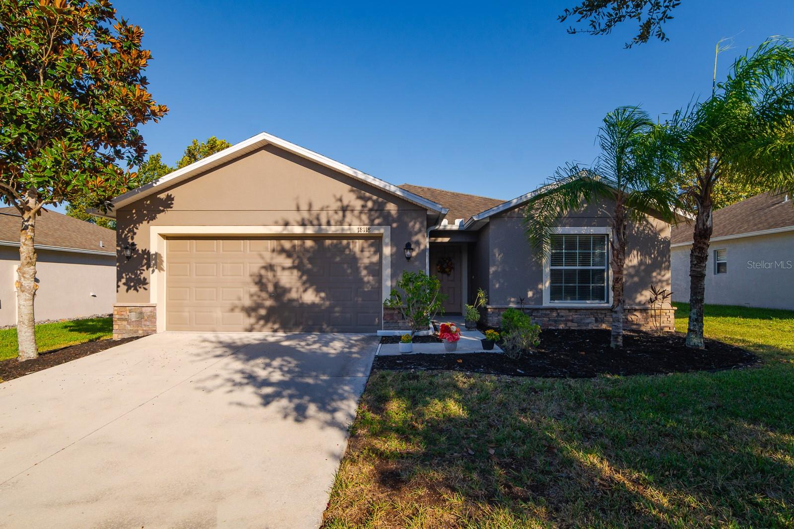 Welcome to Briar Oaks Village in Hudson, Florida! This beautifully maintained 3-bedroom, 2-bath home offers 1,676 square feet of comfortable, move-in-ready living with a warm and inviting feel throughout. Built in 2015, this single-story ranch features a modern, transitional design and thoughtful updates that make it stand out. Step inside to find a bright, open layout with modern laminate flooring in the main living areas and bedrooms—no carpet anywhere! Vaulted ceilings in the main living area provide that feel of extra space and openness! The spacious kitchen features rich wood cabinetry, granite countertops, stainless steel appliances, a breakfast bar, and a cozy eat-in nook overlooking the backyard. The large primary suite includes two closets (one walk-in) and a private bath with dual sinks, a walk-in shower, and a separate toilet room. Outside, enjoy a screened-in patio and a fully fenced backyard with plenty of room to add a pool—plus no rear neighbors for extra privacy. Recent updates include fresh interior paint in a neutral tone, newer fixtures and ceiling fans, updated landscaping with new mulch and shrubs, and trimmed trees for beautiful curb appeal. The home also includes hurricane shutters for peace of mind, and the HVAC system comes with a transferable, prepaid 1-year service contract. Briar Oaks Village is a well-kept community offering low HOA fees, a dog park, and a playground. Conveniently located close to shopping, great local dining, and outdoor adventures at Weeki Wachee State Park and Buccaneer Bay. This home checks all the boxes for first-time buyers, downsizers, and anyone looking for a well-cared-for home in a great location. Don’t miss your chance to see it—schedule your private showing today! *Assumable Mortgage Available at 5.25%-Inquire Within*
