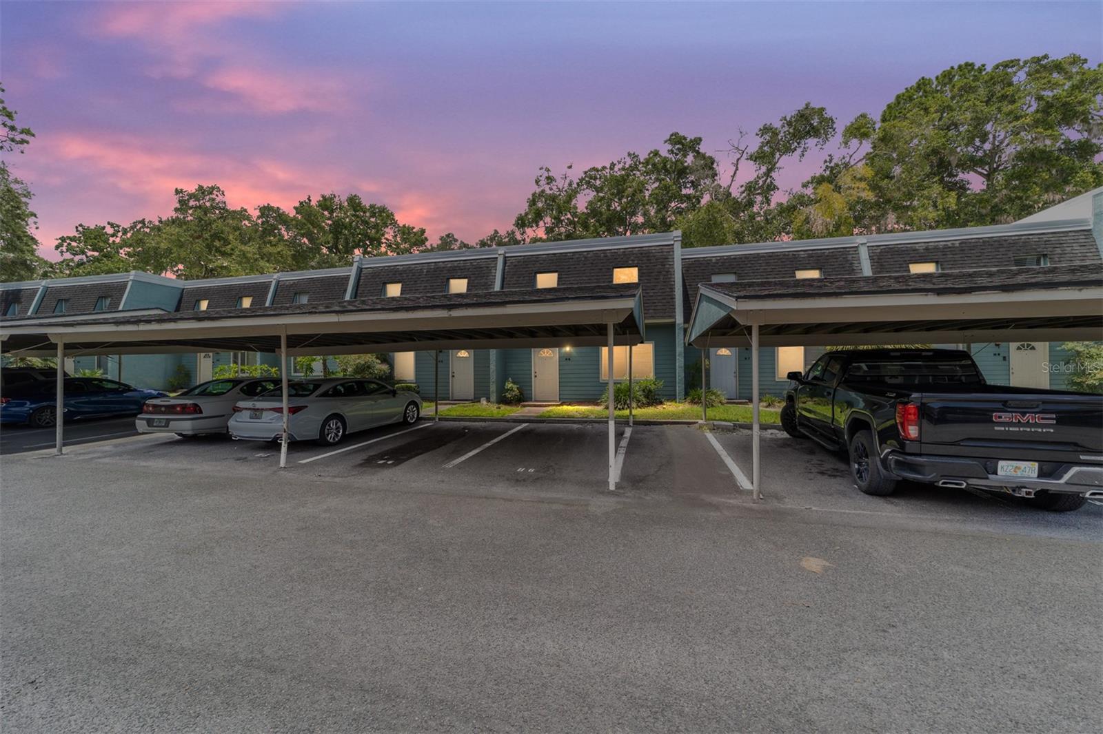 One or more photo(s) has been virtually staged. 4 bed 2/1 bath condominium in Cricket Club. Located near Oaks Mall, I-75, Butler Plaza, lots of shopping and many restaurants near UF and HCA North Florida Hospital. New carpet throughout, freshly painted interior, new roof, newer HVAC. First floor has Large living room, kitchen, dining room, guest bedroom, half bathroom, large screened-in lanai with large backyard. Second story has 3 bedrooms a large primary suite with screen-in balcony. Community amenities include a pool, fitness center, meeting room, laundry facility, and tennis courts Exterior maintenance, water, trash, and grounds maintenance are also included in association dues. This property is also listed in the (REAL MLS #2101347)