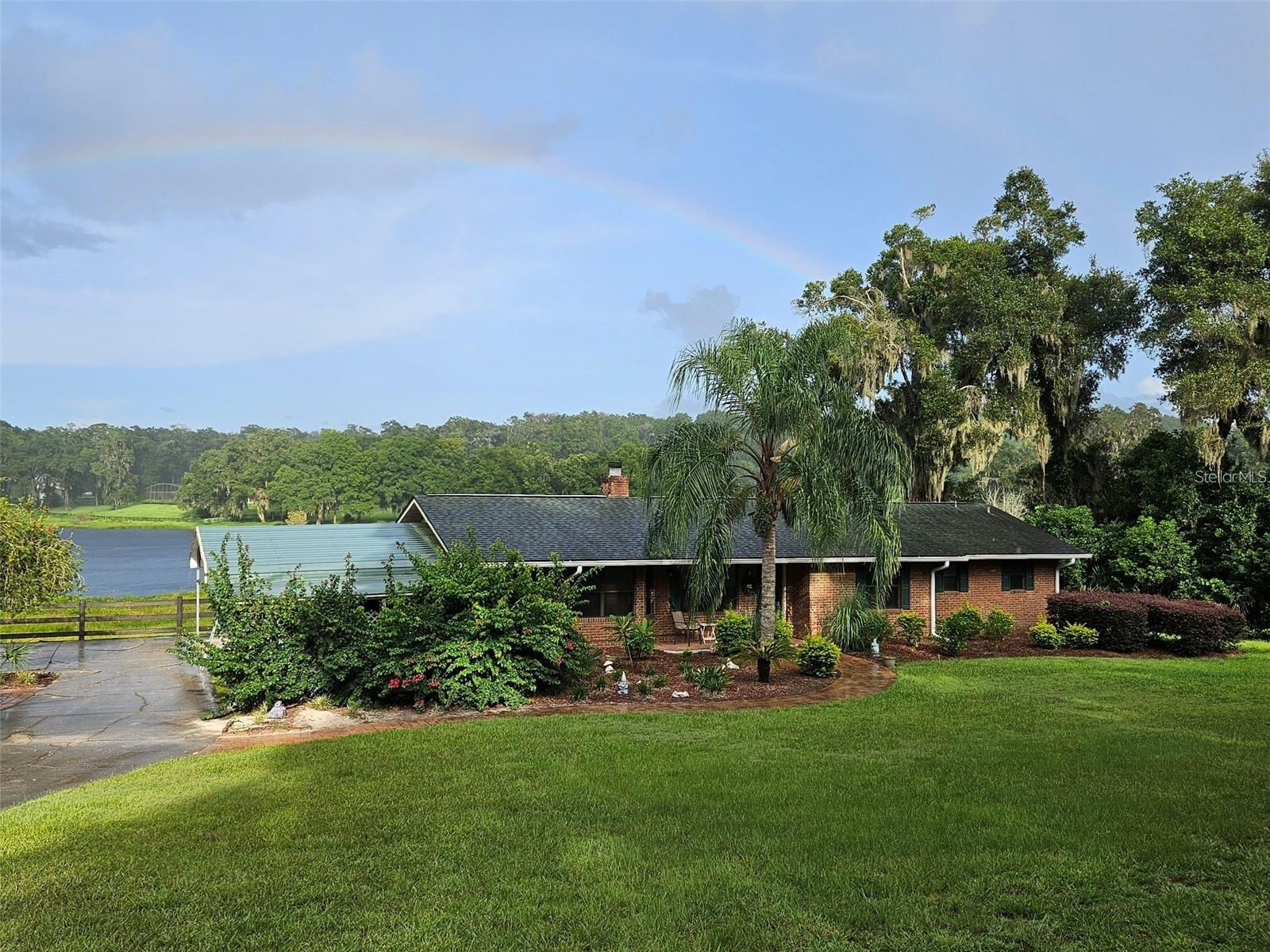 Back on the market! Don't miss this beautiful, unique, 2 home lake front property with a total of 2665sq ft that has both privacy and serenity. This property has no hoa, abundant wildlife, a 900 sq ft seperate inlaw suite/boat house with full kitchen and bathroom with central air, the main house boasts an updated kitchen, new well pump, new well filter, septic has been serviced and cleaned less then a year ago, property sits on a almost 2 acre lot that is unincorporated, it has a wonderful manicured lawn and landscaping, granite countertops and a wood burning fireplace in the main home with vaulted ceilings, new floors, lake frontage, beautiful views, stainless steel appliances, amazing fishing on a spring fed lake, close to shopping, no flood insurance required, the list goes on and on. Schedule a showing today!