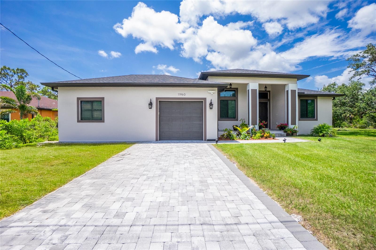 BUILT IN 2023 | MOTHER-IN-LAW SUITE | GOURMET KITCHEN | HURRICANE WINDOWS | 3-CAR GARAGE WITH BATHROOM | 3,288 TOTAL SF | 2,086 SF LIVING
Welcome to this stunning 2023 custom-built home, where elevated design meets versatile living—just minutes from the healing waters of Warm Mineral Springs.
From the moment you arrive, the home’s commanding curb appeal and elevated lot set the tone for what’s inside. Step into a space defined by soaring 10-foot ceilings, 8-foot interior doors, and hurricane-impact windows, creating a bright, open, and airy feel throughout.
The heart of the home is the gourmet kitchen, featuring sleek LG appliances, elegant granite countertops, and abundant workspace—perfect for entertaining or everyday living.
The main residence offers:
2 spacious bedrooms
2 full bathrooms
Formal dining room
Expansive living room
The attached Mother-in-Law suite—ideal for extended family, guests, or rental income—features:
1 bedroom
1 bathroom
Living area & full kitchen
Private entrance
Enjoy the versatility of the Florida room, upgraded with custom cabinetry and a built-in sink—an ideal retreat for work, play, or relaxation.
The oversized 3-car garage includes a dedicated bathroom, providing unmatched convenience for outdoor work, hobbies, or gardening.
Highlights Include:
Built in 2023
Total Area: 3,288 sq ft
Living Area: 2,086 sq ft
10' ceilings throughout
8' interior doors
Hurricane-impact windows
Gourmet kitchen with LG appliances & granite
Private Mother-in-Law suite
Florida room with custom built-ins
3-car garage with full bath
This is more than a home—it’s a lifestyle upgrade. Don’t miss the opportunity to own a beautifully upgraded new construction in one of the most desirable areas of North Port. Schedule your private tour today!
