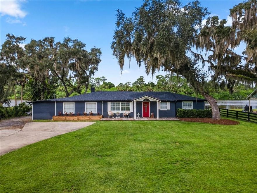 Completely remodeled lake front home in Geneva on 0.66 acres of land on Lake Beatrice. MOTIVATED SELLER. Enjoy sunsets looking west from your back porch – an awesome view that you will never tire of! 4 bedrooms and 3 full bathrooms with 2,234 heated square feet! 2683 total square feet. New kitchen (2023) with white shaker cabinets with bronze hardware, new granite counter tops, stainless steel appliances. New primary bathroom, that also was totally renovated with a large walk-in shower with subway tile & penny tile shower floor; and new vanity with white quartz counter top. New 2023 roof and 2023 repipe. HVAC system and all ductwork, also new in 2023 + new attic insulation. Additional 2023 total remodel includes new interior doors, exterior paint, interior paint, luxury vinyl flooring (except bedrooms 2 & 3 and utility room which have laminate & 3rd full bathroom has tile flooring), 51/3” baseboards, new lighting including recessed lighting in kitchen & hallways. Full bathroom #2 and full bathroom #3 have been updated including new vanities. Back deck remodeled and above ground pool in 2024 & new front deck was added in 2025. The west facing covered back porch is 35’ x 14’. Large shed in back with electricity is included in the sale. Chain length fenced back yard, which does not block the view, but keeps the dog inside the backyard. Floor plan has the primary bedroom with ensuite full bath, and the 4th bedroom also has an ensuite full bathroom + there is a  dedicated inside laundry room and a dedicated inside utility room + the large family room that opens to the kitchen; off the kitchen is a dinette-multi-purpose room.  Seller has added lighting on the house, which works off a phone app, and displays colors that match holiday seasons. Top rated local Seminole County public schools.  Easy drive to Oviedo or to Sanford or to Brevard County & I-95.  This is a perfect home for someone who wants peace and quiet, no HOA, room to park vehicles, and a “backyard” almost private small lake to fish in. Homes on land like this one do not often come up for sale in east Seminole County. The new owner can move right in.  Recent 4 Point Home Inspection ( September 2025 ) is available along with a detailed Feature Sheet. Act now to see this home and call today to set up an appointment.