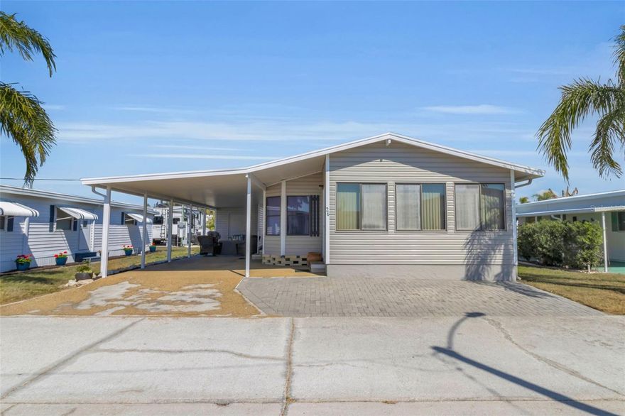 This 1990 manufactured home has been meticulously maintained 2BR/2BA home on the West Side of Paradise Bay, being sold furnished! This 1990 gem is in mint condition, featuring cathedral ceilings and spacious rooms that offer a great sense of scale. A new roof and fresh exterior paint in November 2024, along with a clean, manageable lot and lawn mowing included in your monthly maintenance fee give you more time to enjoy your Florida get-a-way. Enjoy the Gulf breezes from your large enclosed porch, all with the peace of mind of a home that has never had wind or water intrusion per the owner. Paradise Bay is a vibrant, shareholder-owned waterfront community currently experiencing an exciting transformation. There are numerous new homes going in and many units are being meticulously rehabbed, reflecting the pride of ownership throughout. The lifestyle is the main attraction here, with a social calendar full of themed dances, live music, arts, and crafts. Plus, the Rec Hall is currently undergoing a complete renovation! Residents enjoy a heated pool, spa, shuffleboard, bocce, pickleball, fitness center and a boat marina with direct access to the ICW and the Gulf. Whether you are hitting the dance floor or enjoying a quiet moment on a bayfront bench to take in a stunning Florida sunset, this is coastal living at its best. Move-in ready and perfectly positioned just a golf cart ride from Anna Maria Island—come see why so many are choosing to invest in the future of Paradise Bay!