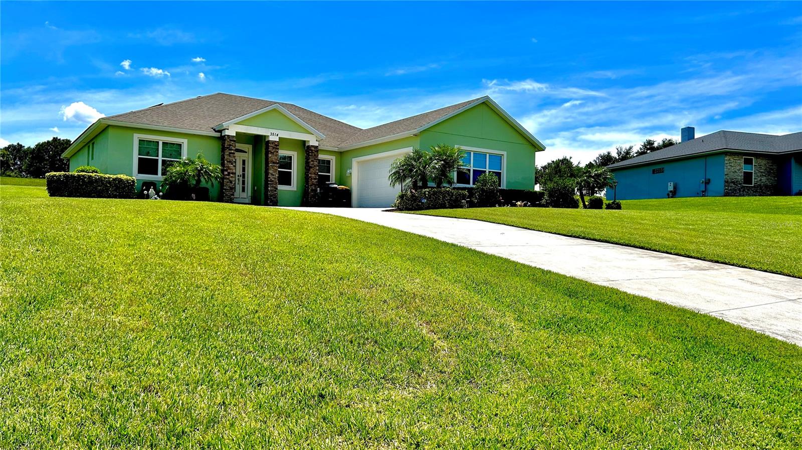 Beautiful 5 Bedrooms 3 Bath home situated in more than 1/2 acres in the impressive gated community at The landings in Lake Easy. This home features a spacious open concept living room with plenty of natural light and a large patio sliding door. The kitchen is equipped with all stainless steel appliances, elegant 42 inch cabinetry, granite countertops and a glass style backsplash. Also included a large breakfast bar and breakfast nook adjacent to large windows. The formal dining area features Lake view from large windows. Other amenities include inside Laundry room with washer, dryer and utility sink. Tile flooring throughout the living area, a third bathroom with patio access to a covered Lanai, stone exterior facade, irrigation system, water well, alarm system, water softener filtration system, private septic tank a large 2 car garage (21'.4" X 24') and a professionally manicured landscape. Solar panels are included with the purchase of this home*