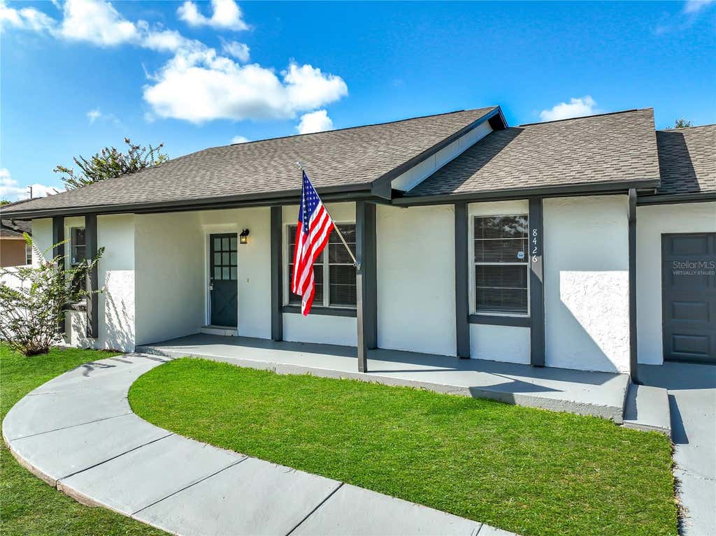 Photo of 8426 Village Green Rd, Orlando, FL 32818 (MLS # O6419473)