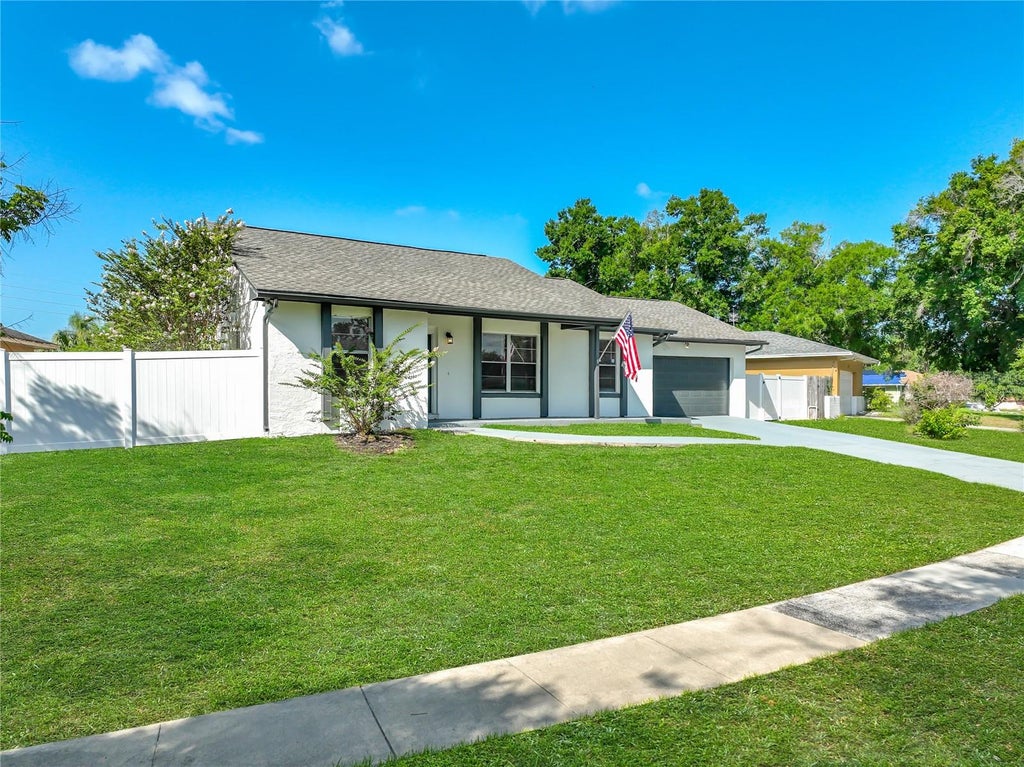 Photo of 8426 Village Green Rd, Orlando, FL 32818 (MLS # O6419473)