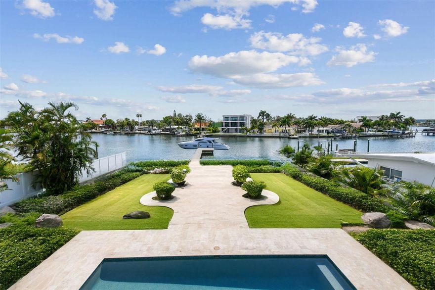 You're looking for a dream home that's got it all - and I've got just the place for you! Introducing 3 Treasure Lane, a stunning luxury waterfront property in the heart of Treasure Island, FL. This incredible single-family home is situated right off the Treasure Island Causeway, offering breathtaking views of the water from almost every room. Can you imagine sipping your morning coffee on your private patio overlooking the ocean?
Build your DREAM backyard oasis on this 15,155 sqft lot with the ability to also add a pool house!
This 3-story masterpiece with your own elevator spans an impressive 3,844 square feet of heated living space, with a total of 6,502 square feet to play with. You'll have plenty of room to spread out with 4 spacious bedrooms, an office, and 4.5 bathrooms - perfect for a growing family or for hosting friends and loved ones. And with a double designer driveway and oversized garage featuring 3 garage door entrances, you can easily fit 6 cars and still have plenty of space to spare. The epoxy-treated flooring is a nice touch, too - no more worrying about stains or damage!

But it's not just about the space - it's about the lifestyle. This home sits on a generous 15,155 square foot lot, giving you all the privacy you need to relax and unwind in your own little slice of paradise. Imagine spending your days lounging by the heated pool and spa, or firing up the outdoor grill and enjoying a delicious meal with the family. And when the sun goes down, cozy up by the ethanol fireplace and TV wall - the perfect spot to watch the game or a favorite movie.

Inside, you'll find all the luxury finishes you'd expect from a high-end property like this. Stainless steel Thermador appliances, glass-encased wine rack, and a book-matched TV feature wall with ethanol urban fireplace all add to the sophisticated ambiance. And with white oak hardwood flooring, and travertine in the primary bathroom, you'll feel like you're living in a luxurious resort.

But what really sets this property apart is its unbeatable location. Just 0.4 miles from the stunning white sands of Treasure Island Beach, you can easily walk, bike, or even ride your golf cart to the shore. And with the Treasure Island Publix just a stone's throw away, you'll never be far from the amenities you need. Plus, with plenty of options for food, entertainment, and fun in the surrounding area, you'll always find something to do.

So why wait? Make 3 Treasure Lane your dream home today and start living the island life you've always wanted. With its unbeatable combination of luxury, location, and lifestyle, this property is sure to check all your boxes. Come see it for yourself and make your tropical paradise a reality!