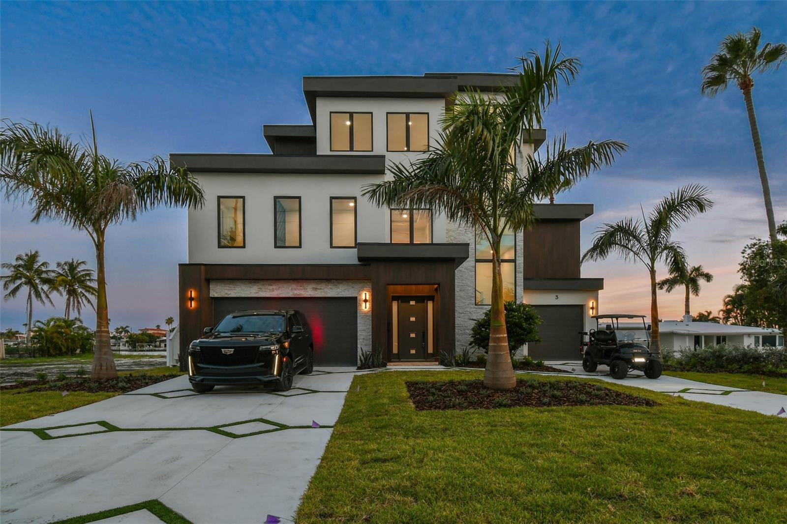 You're looking for a dream home that's got it all - and I've got just the place for you! Introducing 3 Treasure Lane, a stunning luxury waterfront property in the heart of Treasure Island, FL. This incredible single-family home is situated right off the Treasure Island Causeway, offering breathtaking views of the water from almost every room. Can you imagine sipping your morning coffee on your private patio overlooking the ocean?
This 3-story masterpiece with your own elevator spans an impressive 3,844 square feet of heated living space, with a total of 6,502 square feet to play with. You'll have plenty of room to spread out with 4 spacious bedrooms, an office, and 4.5 bathrooms - perfect for a growing family or for hosting friends and loved ones. And with a double designer driveway and oversized garage featuring 3 garage door entrances, you can easily fit 6 cars and still have plenty of space to spare. The epoxy-treated flooring is a nice touch, too - no more worrying about stains or damage!
But it's not just about the space - it's about the lifestyle. This home sits on a generous 15,155 square foot lot, giving you all the privacy you need to relax and unwind in your own little slice of paradise. Imagine spending your days lounging by the heated pool and spa, or firing up the outdoor grill and enjoying a delicious meal with the family. And when the sun goes down, cozy up by the ethanol fireplace and TV wall - the perfect spot to watch the game or a favorite movie.
Inside, you'll find all the luxury finishes you'd expect from a high-end property like this. Stainless steel Thermador appliances, glass-encased wine rack, and a book-matched TV feature wall with ethanol urban fireplace all add to the sophisticated ambiance. And with white oak hardwood flooring, and travertine in the primary bathroom, you'll feel like you're living in a luxurious resort.
But what really sets this property apart is its unbeatable location. Just 0.4 miles from the stunning white sands of Treasure Island Beach, you can easily walk, bike, or even ride your golf cart to the shore. And with the Treasure Island Publix just a stone's throw away, you'll never be far from the amenities you need. Plus, with plenty of options for food, entertainment, and fun in the surrounding area, you'll always find something to do.
So why wait? Make 3 Treasure Lane your dream home today and start living the island life you've always wanted. With its unbeatable combination of luxury, location, and lifestyle, this property is sure to check all your boxes. Come see it for yourself and make your tropical paradise a reality!