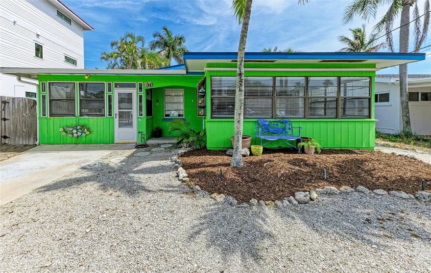 2111 Avenue B – Easy, Classic Island Living!

Welcome to effortless island living in the heart of Anna Maria Island’s beloved “Avenues” neighborhood. Perfectly positioned between the Gulf and the Bay, this home blends timeless Old Florida charm with thoughtful modern updates and resilient construction designed for coastal living.  Built of solid concrete block construction, this single-level residence showcases original terrazzo floors throughout — beautifully preserved and classic to the era. Designed with flood-resilient improvements that deliver both durability and a little extra beachside peace of mind, the home features a new blue metal roof (2024), a complete whole-house replumb, updated electrical with raised outlets, and flood-cut friendly lower wall construction for efficient replacement if ever needed. Durable materials and smart design create both confidence and easy maintenance.

The kitchen offers a modern yet whimsical vibe with stainless steel counters, a new retro-style refrigerator, and new appliances that perfectly compliment the home’s coastal mid-century character.

The updated bathrooms continue the elevated, easy-care aesthetic with frameless shower panels, a floor-mounted pedestal sink, blue sea glass tile accents, and the restoration of the original tub — offering both shower functionality and soaking convenience.

Inside, the home features two bedrooms and two bathrooms, including a private ensuite, along with a separate teen bunk room just off the kitchen that currently serves as a third sleeping area. This flexible space offers endless possibilities — from bonus room to expanded living area. The dedicated laundry room is thoughtfully positioned off the bunk room and includes a stacked washer and dryer and a large utility sink.

Step outside and discover what truly sets this property apart — a generously sized, deep pool built when pools were designed for swimming. The surrounding stone paver deck was meticulously restored in 2024, each paver lifted and reset. The outdoor space provides ample room for sunbathing, grilling, dining, and entertaining, plus a convenient hot and cold outdoor shower for easy beach (and kid) clean-up.

Longtimers call this special neighborhood “The Avenues.” Quiet streets stretch between the Gulf and Bay and lead to a waterfront park featuring a playground, basketball court, new pickleball facility, picnic areas with water views, and a kayak launch. You can easily reach your 10,000 steps without ever leaving the neighborhood.

Beach sunsets are just 400 steps away. For sunrise and dolphin watching, the Bay is only 200 steps from your door.

Easy. Classic. Timeless ** Property information received from third-party sources is considered reliable but is not guaranteed.  All information should be independently verified by buyers and buyers agent.