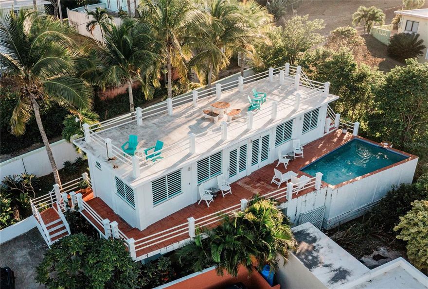 Welcome to La Roca, a rare turn-key income property in the heart of Bravos de Boston, one of Vieques Island’s most sought-after neighborhoods. Just a few hundred feet from the Caribbean Sea and close distance to the ferry, beaches, restaurants, and Isabel Segunda, this titled multi-unit home combines scenic beauty with strong rental history, making it one of the most compelling offerings in Vieques real estate.

Perched on a quiet cul-de-sac with elevation that captures both views and breeze, La Roca is a solidly built, three-level concrete structure designed for income generation and island living. The main rental level includes two mirror-image 1-bedroom units, each with an open-plan living/dining area, kitchen, full bathroom, and direct access to a large ocean-facing deck and private pool. Each unit is perfectly appointed for guests seeking comfort, convenience, and a view-filled Caribbean experience.

Above the rentals, a spacious rooftop deck offers sweeping views of the turquoise waters and north coast of Vieques, with plenty of room to create a rooftop lounge, yoga platform, or stargazing area. Below, the ground floor offers substantial enclosed storage space ideal for gear, tools, or future conversion into an owner’s unit or third rental. This layout offers incredible flexibility—live in one, rent the others, or operate all as short-term rentals.

Features include:

Concrete construction across all levels

Ocean views from multiple vantage points

Private in-ground pool with sun deck

Rooftop terrace with 180° views

Airy covered decks for lounging or dining

Quiet, walkable neighborhood near town

Proven vacation rental performance

Fully titled parcel

The current owners have operated La Roca as a successful short-term rental for years while also using it as a private getaway. That dual use—personal enjoyment and income—makes this property ideal for investors, part-time residents, or anyone seeking a self-sustaining Caribbean lifestyle.

Located in Bravos de Boston, a historic and charming enclave on the north shore of Vieques, La Roca is close to ferry access, shops, grocery stores, and some of the island’s best snorkeling spots. It’s also a short drive to Esperanza, the island’s vibrant southern beach town, and minutes from the world-renowned Bioluminescent Bay.

If you’ve been searching for Vieques real estate with income, views, and walkability, this is the opportunity. La Roca delivers on location, layout, and long-term value—whether you’re looking to generate cash flow, enjoy an island lifestyle, or both.