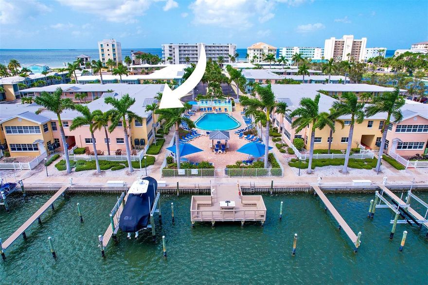 Coastal paradise awaits with fully furnished condominium in Indian Shores. Discover the epitome of coastal living in this stunning second-floor condominium, situated to offer breathtaking views of the Intracoastal Waterway, marina and pool. This prime location in Indian Shores, between Gulf of Mexico and Intracoastal Waterway, promises a lifestyle of relaxation and adventure. This fully furnished, turnkey beach condominium features one bedroom, one bath and a bonus sunroom that bathes the space in incredible natural light. Meticulously updated with coastal-inspired décor, the open floor plan showcases wood-inspired luxury vinyl plank flooring throughout, gleaming white crown molding, and stylish white wood cabinetry, with fashionable quartz countertops. The spacious bath is equipped with a walk-in shower with fully custom tiled walls and upgraded frameless glass doors. The living room, centrally between dining area and sunroom, has a leather sofa and recliner with a flatscreen TV, making it a spot for entertaining. The sunroom, complete with a sofa and high-top dinette table, or it can serve as an additional guest area or cozy office. The fully equipped kitchen boasts quartz countertops, stylish backsplash, full-size appliances and coffee bar, ensuring all your culinary needs are met. Barefoot Beach offers a waterfront oasis with lush landscaping and an array of amenities, including a heated pool and sun deck, a new community fishing dock, barbecue grills, outdoor dining areas, multiple laundry facilities on every floor, bike storage and a club room. Private boat slips are available for rent or purchase, and there is beach access directly across the street with a signaled crosswalk on demand. With no rental period restrictions, this property is an ideal investment opportunity, second home or primary residence, allowing owners to enjoy the flexibility of using the on-site property management or choosing their own rental company. Enjoy the quaint beach town of Indian Shores, where you’ll find nearby dining, shopping, miniature golf and pristine white sugar sand beaches. The Suncoast Beach Trolley is near your door, providing easy access to various attractions along Pinellas Beach Coast. Explore the vibrant nightlife, museums and famous pier in downtown St. Pete, all just a short drive away. With two international airports nearby, TIA just 45 minutes away and PIE only 25 minutes, you’ll have easy access to travel. Don’t miss out on this coastal dream! Contact us today to schedule your private showing.