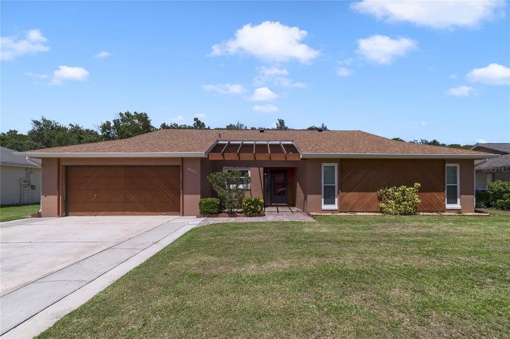 Photo of 12631 Indiana Woods Lane, Orlando, FL 32824 (MLS # O6446247)
