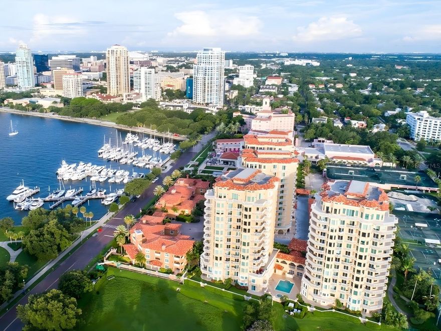 Experience luxury waterfront living in the heart of downtown St. Petersburg at the exclusive Vinoy Place Condominium. Unit 833 offers a rare opportunity to own a beautifully updated residence with unobstructed views of Tampa Bay and The Pier. A private elevator opens into your own foyer, leading to a light-filled, open floor plan that flows seamlessly between living, dining, and outdoor spaces. The home features approximately 2,600 square feet of interior living space, complemented by 428 square feet of wraparound balconies—perfect for enjoying morning sunrises and coastal breezes. The newly renovated kitchen is a chef’s dream, equipped with a 36-inch Wolf induction range, granite countertops, a custom backsplash, center island, and dry bar. The spacious primary suite includes a private sitting area, large walk-in closet, and a luxurious bath with a freestanding soaking tub and walk-in shower. Additional highlights include engineered Rio red oak hardwood flooring, fresh interior paint, a versatile bonus room ideal for an office or media space, motorized window shades, and a separate laundry room with cabinetry and a sink. Additional upgrades include new HVAC systems, water heaters and LED lighting. Residents enjoy access to premier amenities such as two heated pools with spa, a fitness center, social and billiards rooms, outdoor kitchen, 24/7 gated security, ample guest parking, and two under-building parking spaces plus a climate-controlled storage unit. Just steps from the waterfront, parks, restaurants, and galleries—and only 25 minutes to Tampa International Airport—this exceptional home offers the perfect blend of elegance, comfort, and convenience.