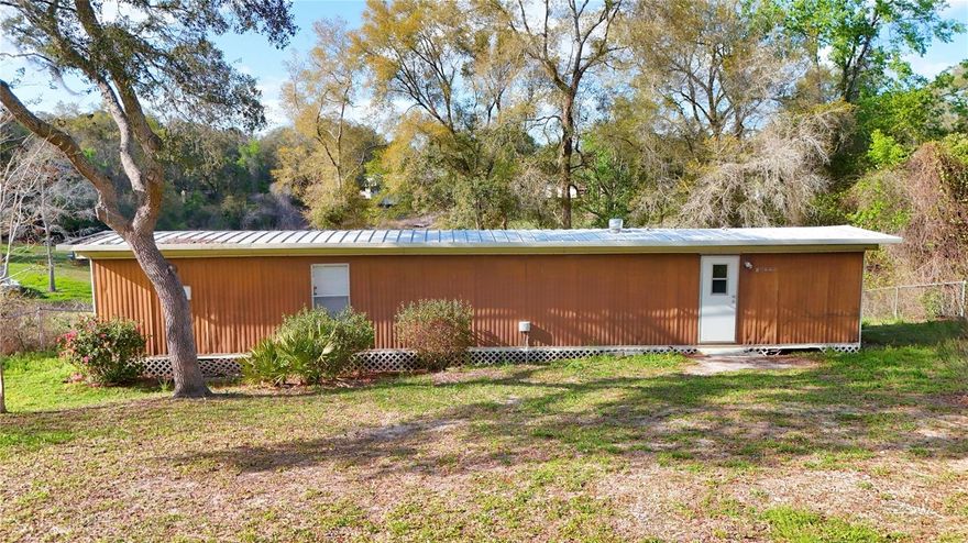 **Investor Opportunity with Lake Views & Total Privacy!** This 2-bedroom home in the Halfmoon Mini-Farms community offers a rare combination of security and scenery, featuring a **fully gated**  and a **picturesque lake view** right from your backyard. Perfectly positioned just a short drive from the heart of **Ocala**, this property is an ideal income-producing investment, whether you’re looking for a steady rental or a high-equity flip. Situated on over half an acre (**0.51 AC**), the land is high and dry in **Flood Zone X**, meaning no flood insurance is required. With **low annual taxes** ($1,006 in 2025), no HOA fees, and close proximity to Silver Springs State Park and the World Equestrian Center, this property offers incredible upside with minimal overhead. Priced at **$95,000**, this is a prime chance to secure a water-view asset in a rapidly growing market. **Cash offers only.**