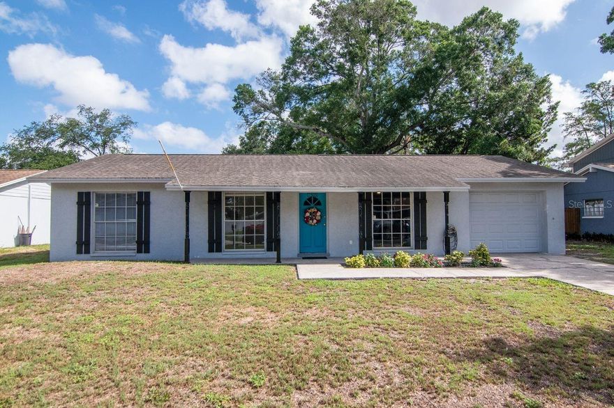 Welcome to Twelve Oaks! This beautifully maintained 4-bedroom, 2-bathroom single-story home offers a bright and airy open-concept layout filled with natural Florida sunshine. Spacious living and dining areas feature beautifully warm flooring and seamless flow, perfect for entertaining and everyday living. Located in the heart of the home is the kitchen, it is equipped with stainless steel appliances, ample cabinetry, generous counter space, quartz countertops and a cozy breakfast bar overlooking the main living area. This space is perfect for work or hosting friends for dinner together. The double glass doors lead you into a 4th bedroom that is separate from the other bedrooms and can be used as a guest space, office, den, craft or playroom. The possibilities are endless.  Enjoy peaceful backyard views with no direct rear neighbors, creating added privacy and a relaxing outdoor setting. It is the blank canvas for all of your backyard dreams to come true! The oversized screened-in lanai is ideal for year-round enjoyment, morning coffee, or hosting gatherings while overlooking the spacious backyard. The split-bedroom floor plan provides comfort and functionality, while large windows throughout the home fill the space with natural light. The primary bedroom is expansive and offers two closets for all of your storage needs. Conveniently located in the desirable Twelve Oaks community in Tampa, close to shopping, dining, parks, and major roadways. Seller offering a $10,000 credit to the buyer at closing with a accepted offer to replace the roof as it is 18 years old. Call today for your private showing!
