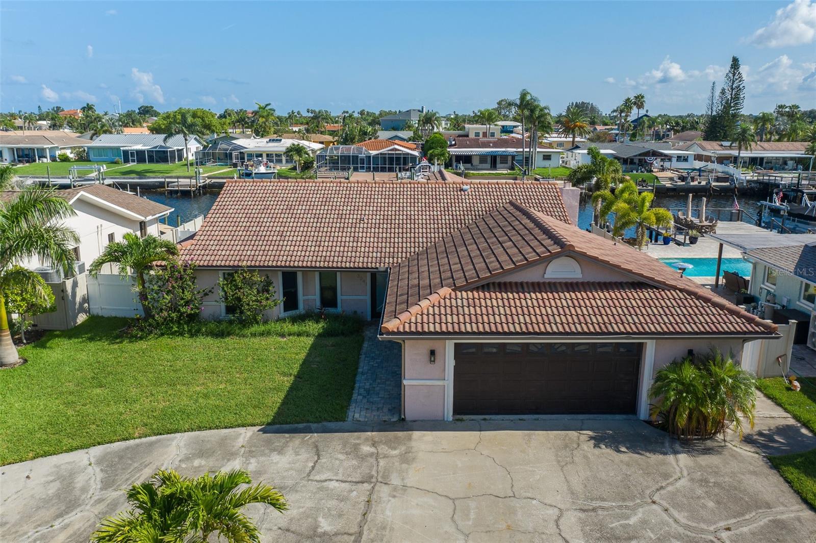 This is the only home available with stunning views of the Gulf of Mexico for under $1 million! Picture yourself stepping out your back door, hopping on your boat, and cruising into open Gulf waters within minutes—it doesn’t get better than this. Located at the end of a quiet cul-de-sac on the prestigious South Channel, this spacious 3-bedroom, 3-bathroom waterfront retreat offers deep water access, a private boat lift, and the true tropical lifestyle you've been dreaming of. The home boasts an airy open floorplan, a modern custom kitchen, updated bathrooms, and a sleek contemporary design throughout. Take in breathtaking sunsets from your private pool, framed by panoramic Gulf views. A two-car garage adds convenience and storage for your beach toys and gear. As a resident of Gulf Harbors, you’ll also have the option to join the exclusive private beach club—complete with cabanas, restrooms, and white sandy shores.
Gulf views. Boat access. Private beach. All under $1M.
What are you waiting for?