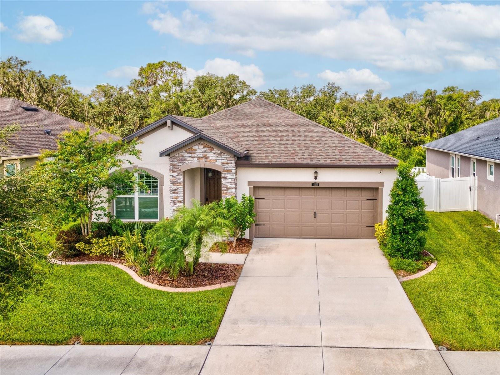 This 5 year young, 3/2/2+office is a MattAmy Home 1752 sq ft~~As you enter to the left is an Office w/French Doors that could be a 4th bedroom~Large Open Kitchen, Dining & Living Room~~Kitchen is ready for the chef in you!~ Quartz Counters, white cabinets, stainless appliances, large island with additional storage, large pantry~~Tiled wood grain look flooring and Lots of natural light~~large dining area that leads into Family Room~~Master bedroom is split from other bedrooms, it has a large walk-in customized closet and en-suite bathroom w/shower, double sinks and water closet~~beautiful windows looking out to serene conservation area~~2 more bedrooms and large guest bath complete the home~~Inside Laundry Room leads to large 2 car garage w/epoxy floors~~Screened patio to enjoy beautiful sunsets and conservation and large privacy fenced yard (how about adding a pool)NO rear neighbors~~Triple Creek is a nature preserved community with miles of walking trails, community pool, fitness, tennis courts, park, dog parks etc.~Enjoy all the nearby shopping and easy access to I-75~~Make this almost new home yours to enjoy! Elementary school right in the neighborhood~Low annual HOA fee $100. CDD included in taxes.