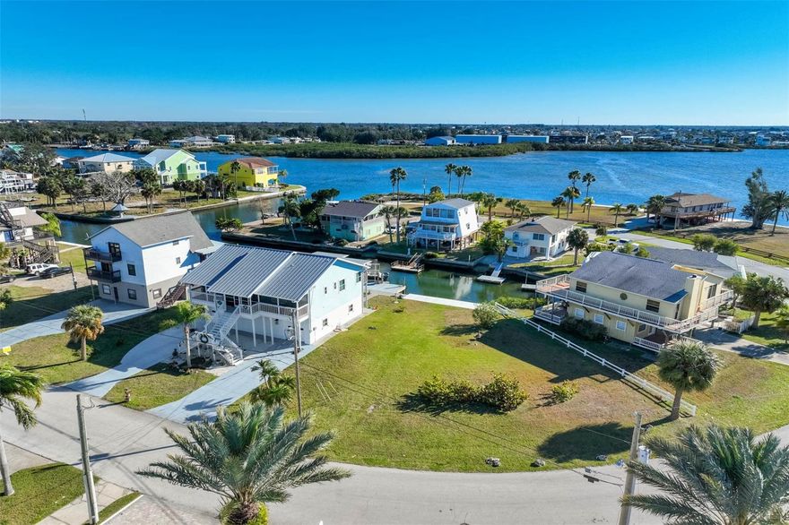 Build your coastal dream on this rare direct-waterfront lot with sweeping Gulf views. Positioned directly on the water while providing open vistas toward the Gulf, this exceptional homesite delivers the best of both worlds—protected frontage with quick access to open Gulf waters.

The lot uniquely fans out toward the water, allowing for a thoughtfully designed backyard and expanded outdoor living space while maximizing water views. A brand-new seawall completed in 2025 enhances long-term value and peace of mind, complemented by a protected docking area off the seawall that can shield vessels from Gulf winds while still providing fast, convenient access to the Gulf.

Located in a waterfront neighborhood, this property presents a compelling opportunity for both end users and investors. A survey is available, making it easy to move forward with design and planning. Direct waterfront, Gulf views, protected dockage, and open-water access—an exceptional foundation for your future coastal home.