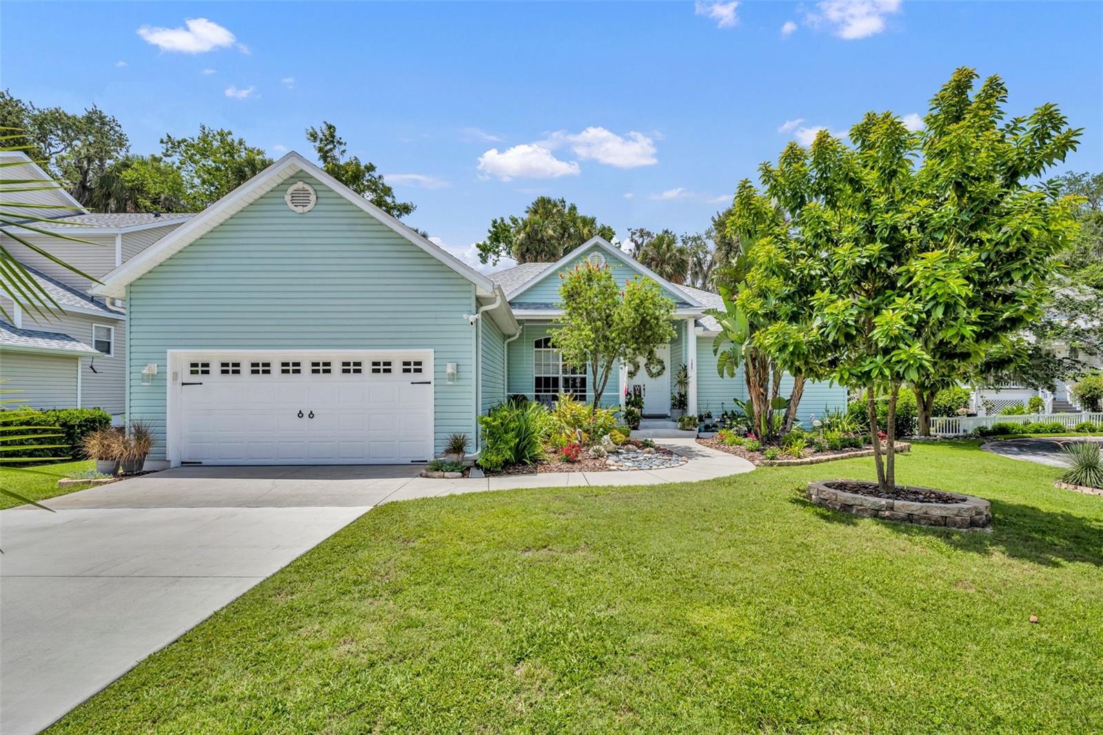 Riverfront living at its finest in the gated Marine Community of River Oaks on the St. Johns River! This beautifully maintained 4-bedroom, 3-bath home combines classic Southern charm with modern updates and includes a BOAT SLIP! Step onto the welcoming front porch and into a light-filled, open floor plan featuring updated stainless steel appliances, a wet bar, spacious living areas, and a smart split-bedroom layout for privacy. The primary suite offers direct access to the screened-in porch, two walk-in closets, and a private en-suite bath with dual sinks, a spacious walk-in shower, garden tub, and a separate water closet—your own private retreat. Two of the secondary bedrooms share a convenient Jack-and-Jill bathroom, while the fourth bedroom and full guest bath provide flexible space for visitors or a home office. Enjoy year-round outdoor living on the screened-in porch with an exhaust fan for grilling, or relax on the rebuilt Trex deck with modern cable railings, all overlooking a beautifully landscaped yard and peaceful views. This home also includes a boat slip at the private community dock, making it a true boater’s paradise. A new roof and HVAC system (2024) provide peace of mind for years to come. River Oaks offers residents gated security, a community pool and spa, clubhouse, a playground, and lawn maintenance. Just minutes from Gemini Springs Park, walking and biking trails, SunRail, and I-4. Don’t miss your chance to own a truly turn-key riverfront retreat in one of DeBary’s most desirable neighborhoods!