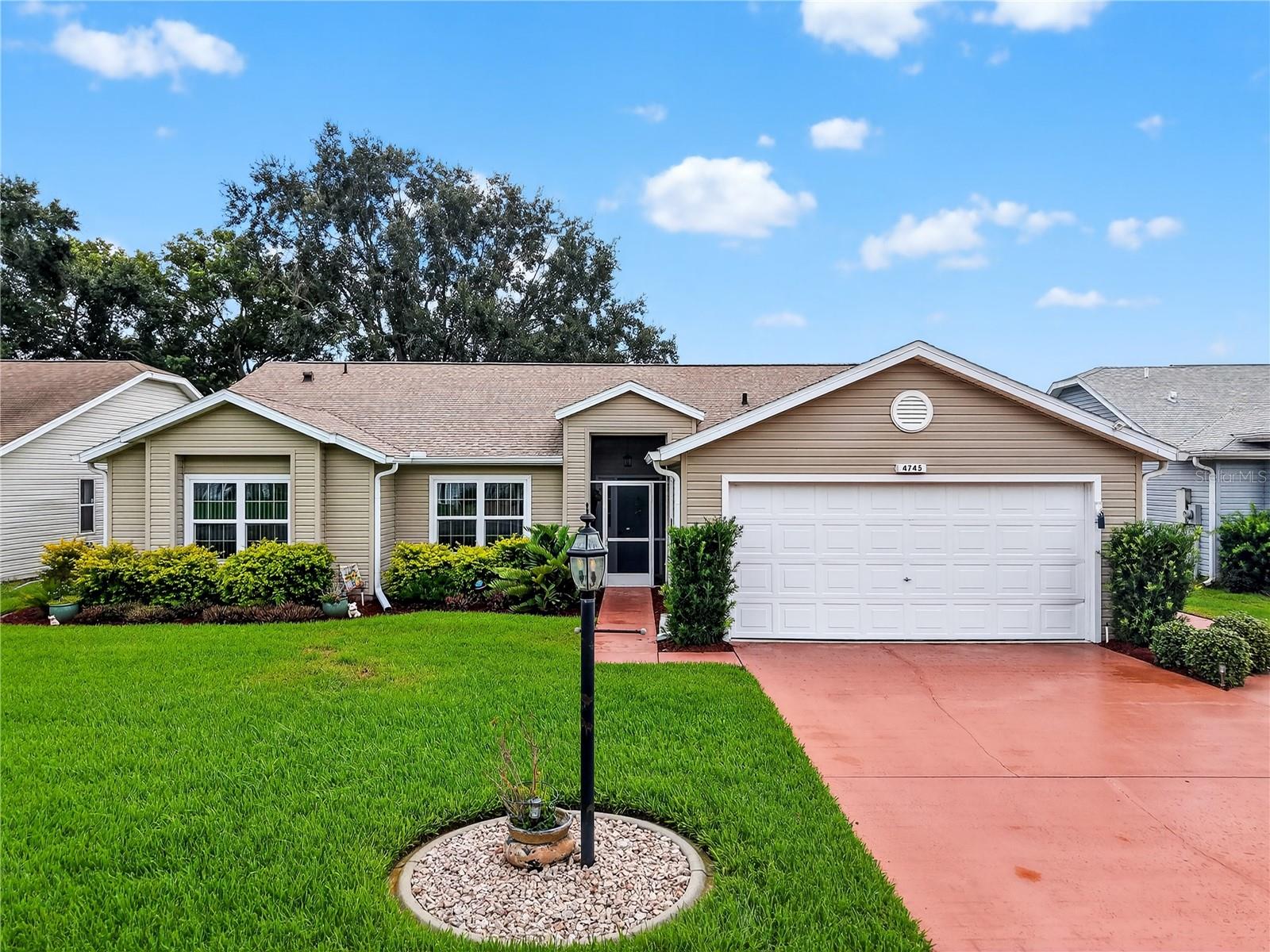 Welcome to this perfectly maintained 3-bedroom, 2-bathroom home located in the award-winning Plantation at Leesburg community. With an open floor plan, this home offers a spacious, light-filled kitchen featuring ample counter space, plenty of cabinets, and a cozy 13 x 10 dinette area — ideal for everyday meals or casual gatherings.
The split floor plan provides privacy for the owner’s suite, which includes a walk-in closet and a private bathroom. The additional two bedrooms are well-sized and include generous closet space, perfect for guests or extra storage. The living and dining areas flow seamlessly, creating a comfortable and welcoming space for relaxing or entertaining.
Step outside to your enclosed 27 x 10 lanai, where you can enjoy the peaceful view of your private backyard — a perfect spot for morning coffee or quiet evenings. Recent updates include double-pane windows, a newer hot water tank, a newer roof (2023), and a newer AC system (2023), offering peace of mind and efficiency for years to come.
This gated, 55+ neighborhood offers a vibrant lifestyle with something for everyone: three swimming pools, two fitness centers, three clubhouses, a billiard room, a softball field, two golf courses, tennis courts, and popular pickleball courts. Take your golf cart to the on-site restaurant for lunch, dinner, or weekend live music and specials.
With a low HOA fee and 24-hour manned security gates, this community combines comfort, convenience, and fun — all just minutes from shopping and everyday needs. This home is move-in ready and waiting for you to enjoy everything The Plantation has to offer.