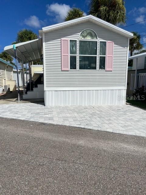 This home has survived all the hurricanes since 1994 with little to no damage. Despite the storm surge from Milton, there was not any water or sand in this home. It is a 1994 Park Model Home that has been owned and maintained by family members since it was set. It comes completely furnished. Includes large shed. A total remodel was completed in 2022-2023, including new plumbing, water heater, roof, lifeproof flooring, ceiling fans, cabinets, lighting, paint, tile walk in shower, toilet, new 24’ awning, etc.. Paver parking 2024. New, elevated AC 2025. This home is beautiful inside and out. Gulf to Bay is a 55+ community. It is a pet free community, but emotional support animals are allowed, with proper paperwork. Land is owned by the owners, (Cooperative ownership) with no lot rent, just a low $115 per month HOA fee which covers the common areas and lawn care. Amenities include a private beach on the Gulf, docks available for rent, and a private boat ramp to launch your boat, paddleboard, or kayak. There are two laundry rooms with bathrooms, clubhouse, and a beautiful pavilion for watching the dolphins and manatees. You can fish from the docks or sea wall. Five restaurants within 10 minute walk, or call the local free shuttle. There are 4 public beaches on Manasota Key. Annual boat races in the Fall. Don’t miss your chance to own a beautiful piece of paradise.